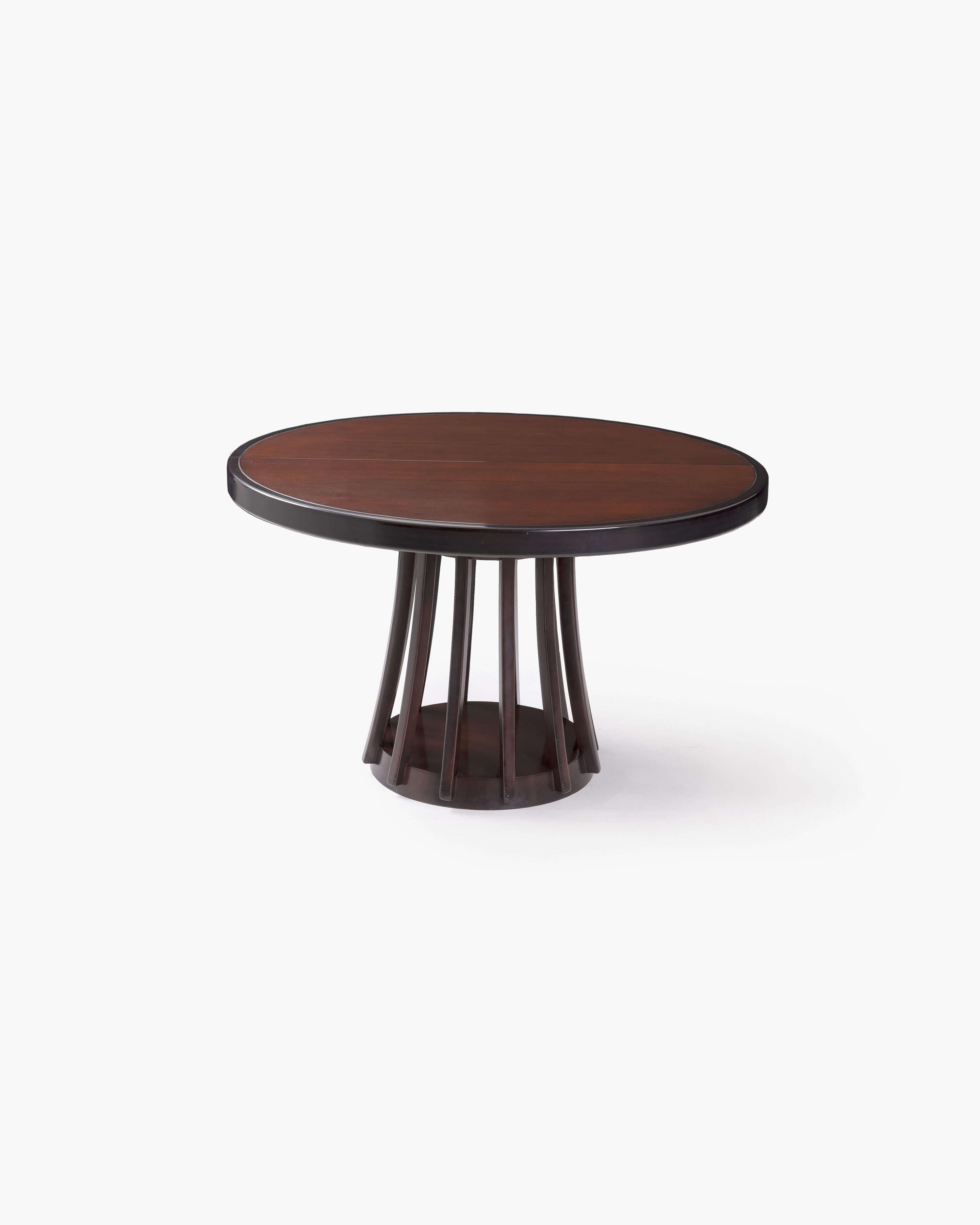 Experience the timeless elegance of Angelo Mangiarotti's design with this exquisite round extendable dining table. Created in 1972 for La Sorgente dei Mobili, a renowned member of La Permanente Mobili Cantù, this table is a true testament to