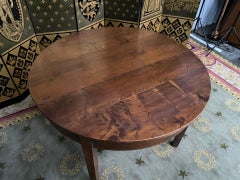 Round farmhouse table in walnut with apron