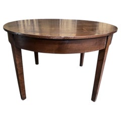 Round farmhouse table in walnut with apron