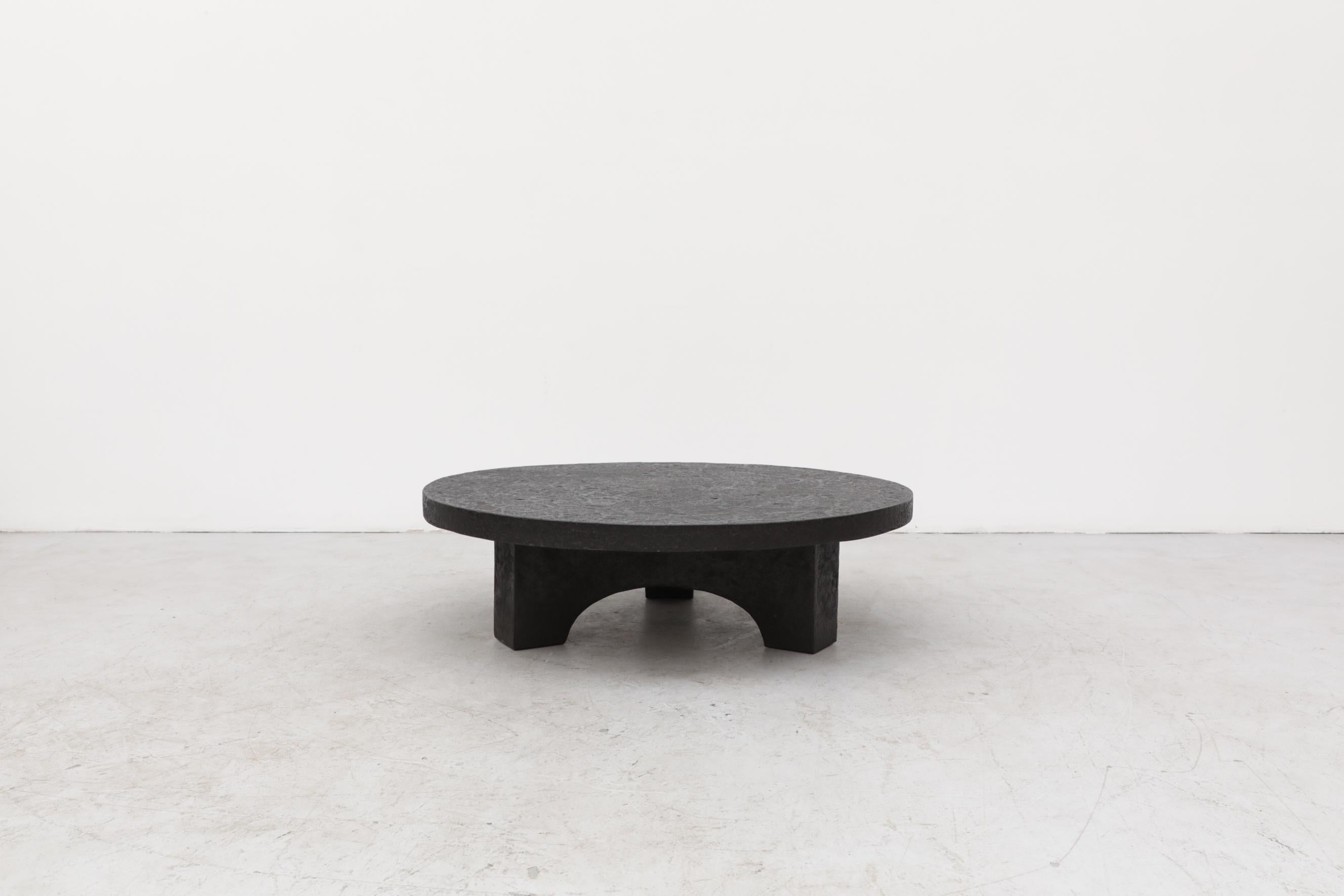 Round Faux Lava Stone Coffee Table with Arched Base 1