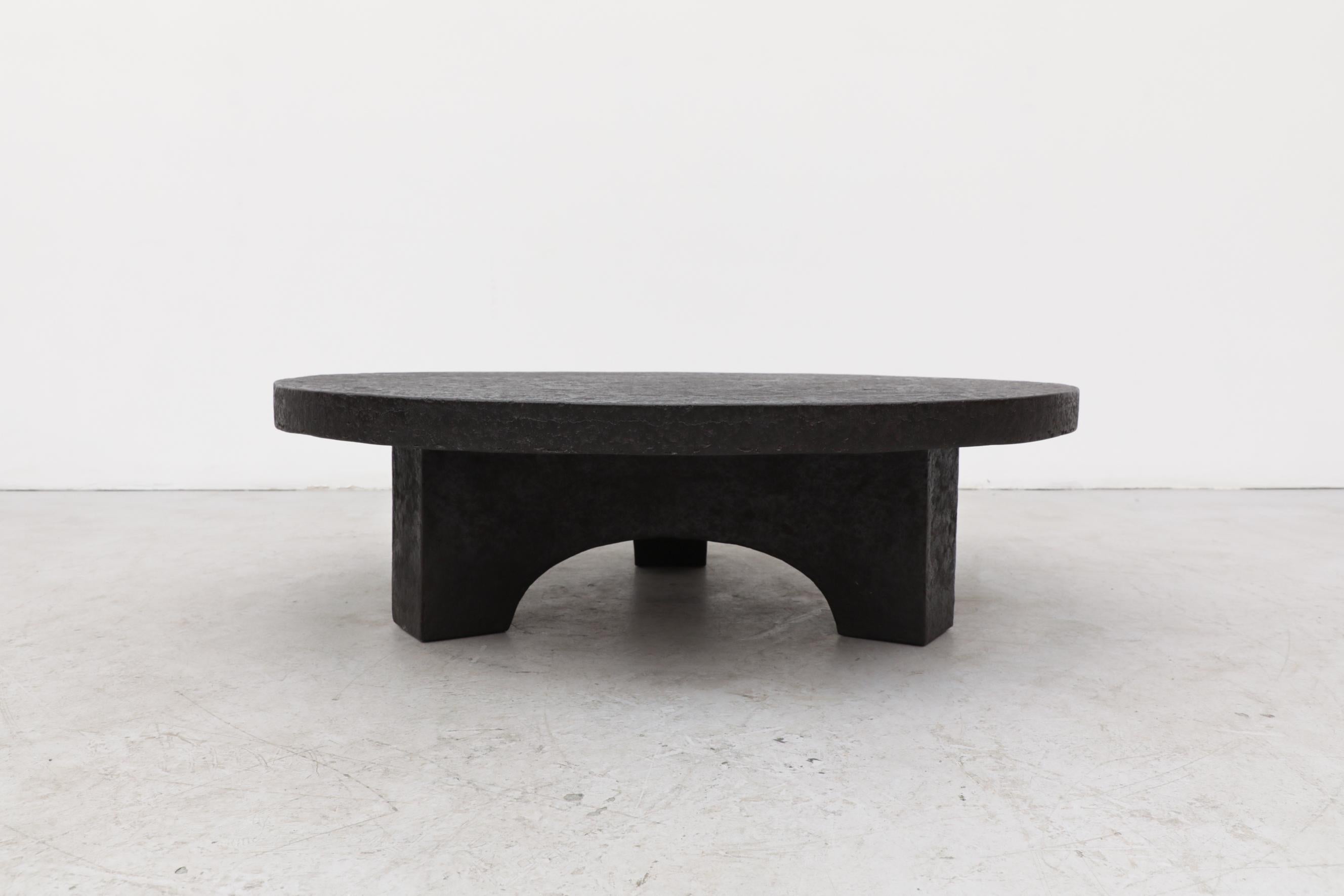 Round Faux Lava Stone Coffee Table with Arched Base 2