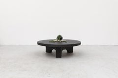 Round Faux Lava Stone Coffee Table with Arched Base