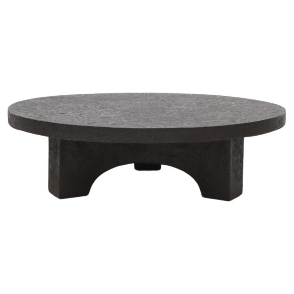 Round Faux Lava Stone Coffee Table with Arched Base
