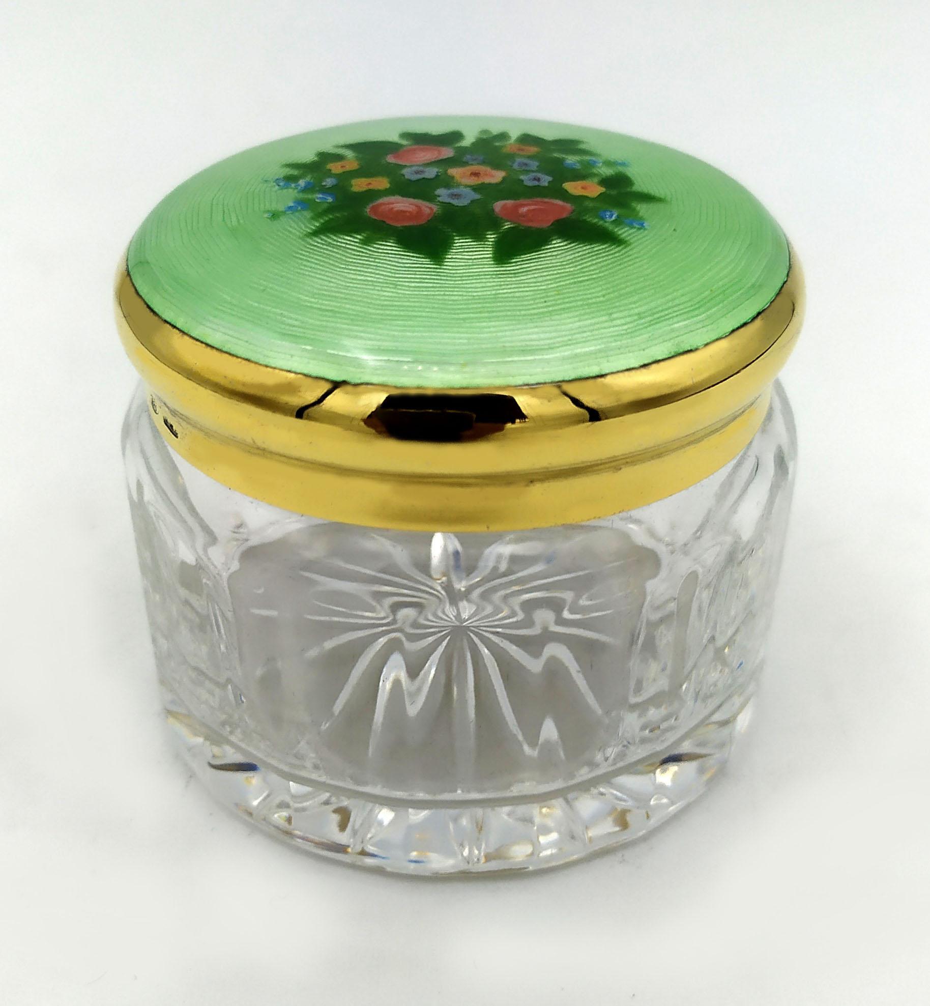 Round favor box with lid in 925/1000 sterling silver gold plated with translucent fired enamel on guillochè and hand-painted miniature of a bouquet of flowers in Art Nouveau style. Below in cut crystal. Diameter cm. 6.8 lid height cm. 2, total