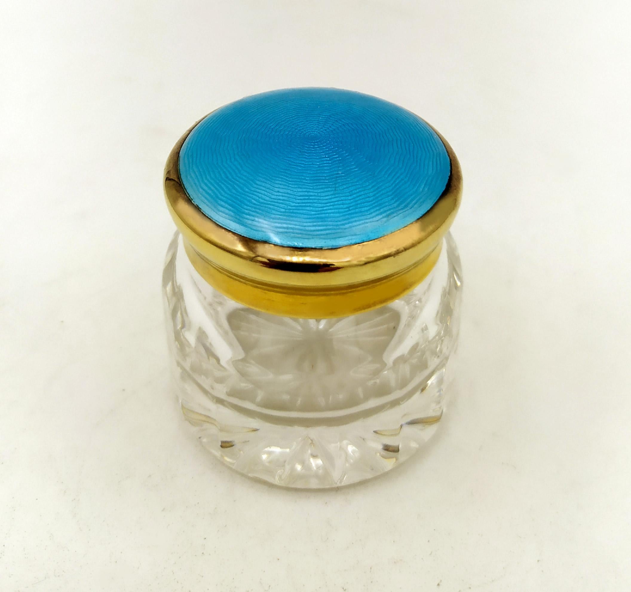 Round favor Box with lid in 925/1000 Sterling Silver Light Blue Enamel Salimbeni. Favor or small container in cut crystal and lid in 925/1000 sterling silver gold plated with translucent fired enamel on guillochè. Diameter cm. 4.2 total height cm.