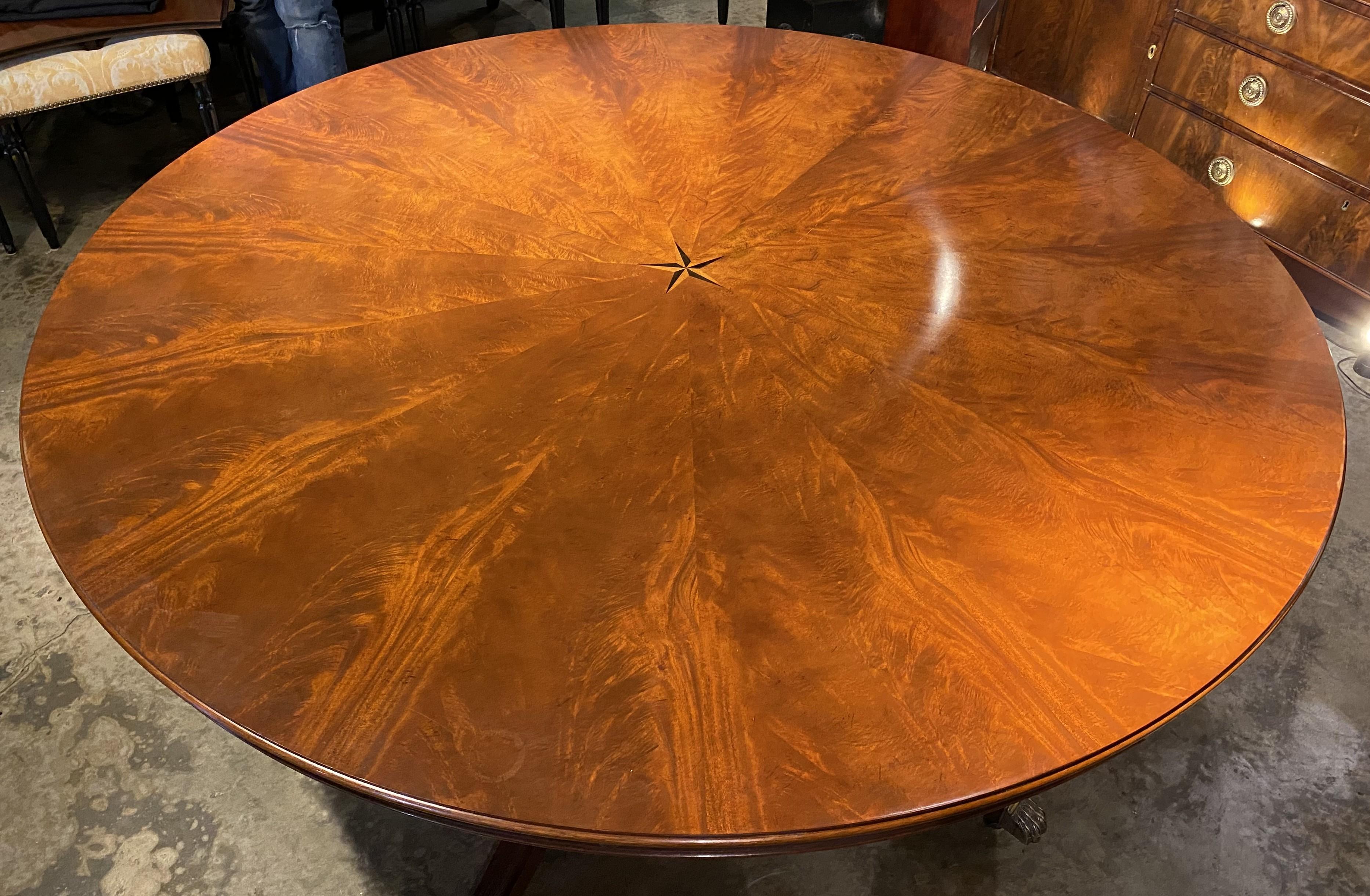 Round Figured Mahogany Jupe Style Dining Table with Five Leaves and Star Inlay For Sale 4