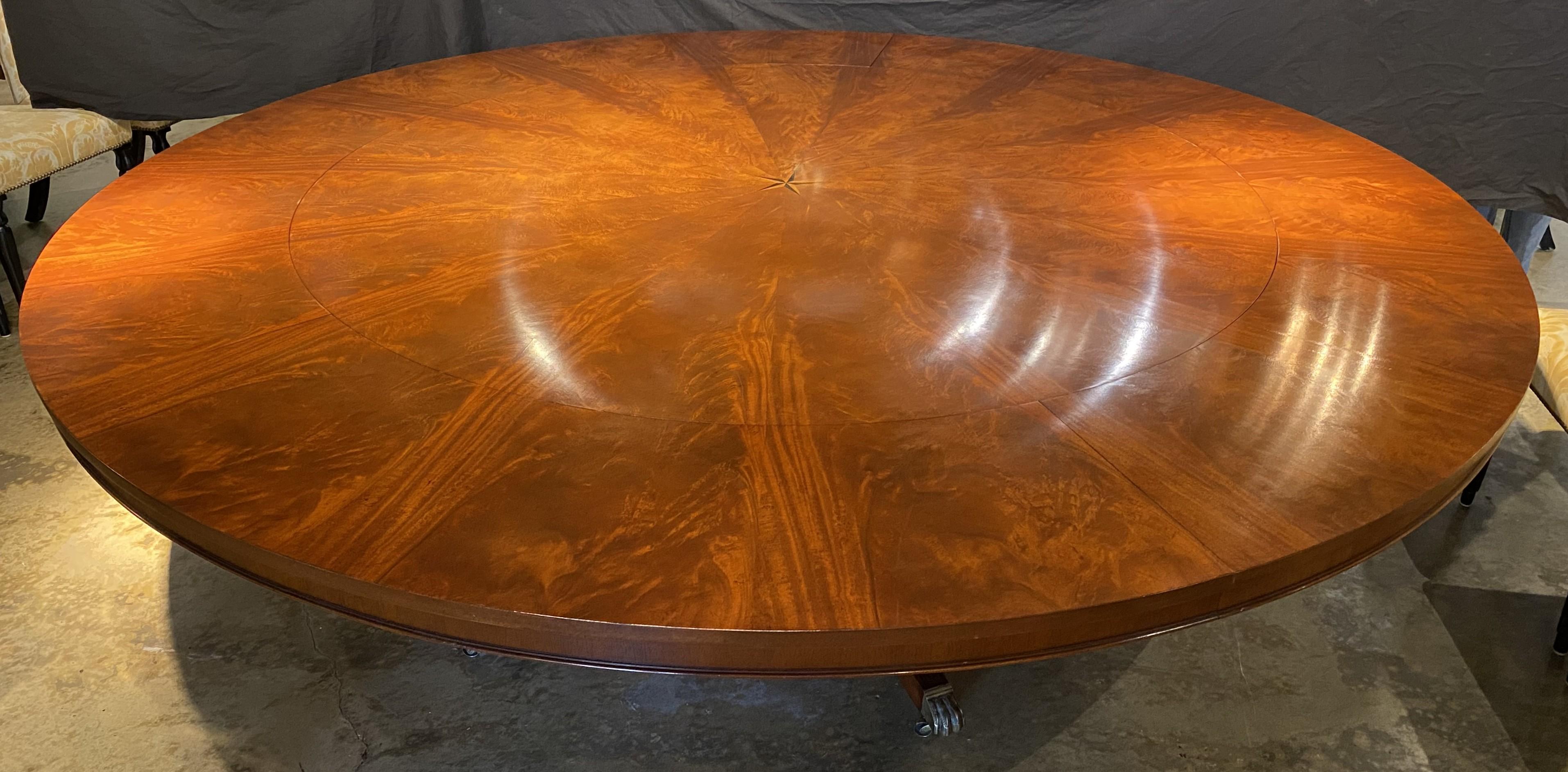 English Round Figured Mahogany Jupe Style Dining Table with Five Leaves and Star Inlay For Sale