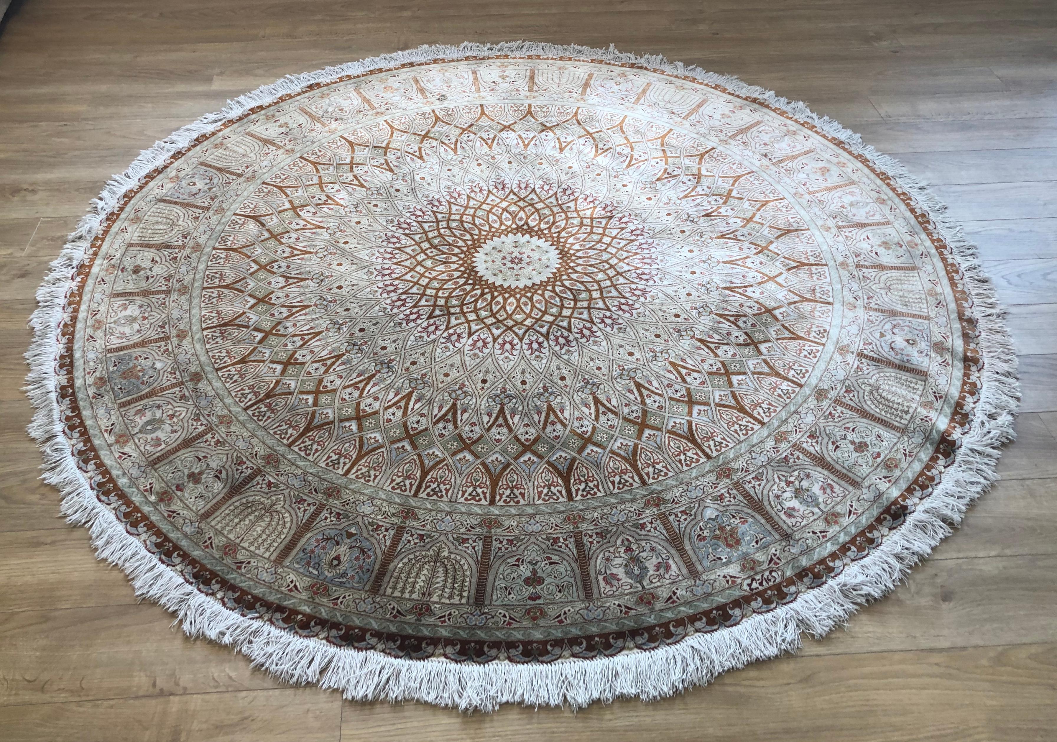 Very beautiful signed vintage Persian Qum Kazemi silk rug with floral decoration in light beige, brown and green colors in very good condition. Made of 1100000 knots per sq.m.
