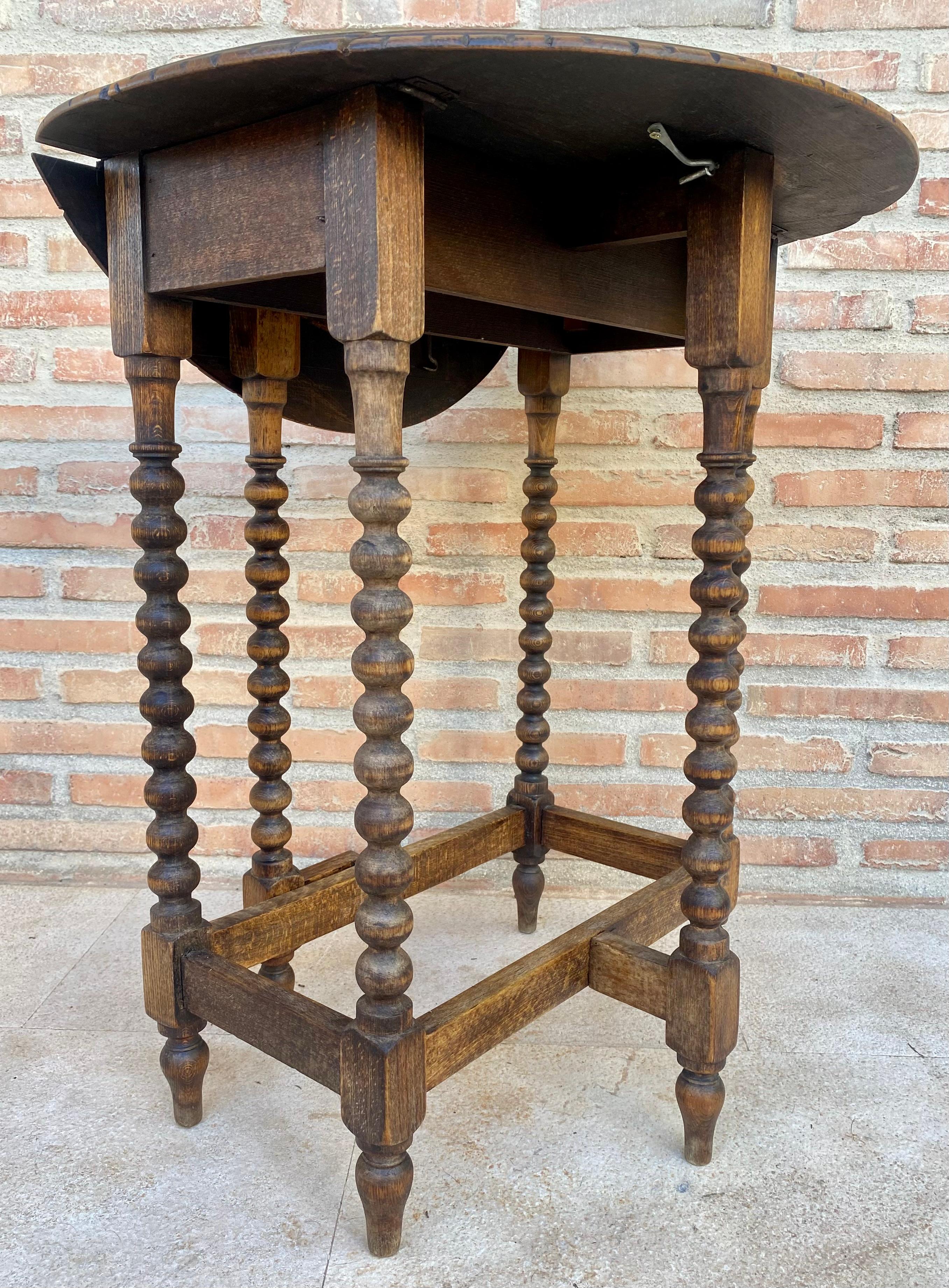 20th Century Round Folding Center Oak Table with Carved Top and Solomonic Legs, 1940s