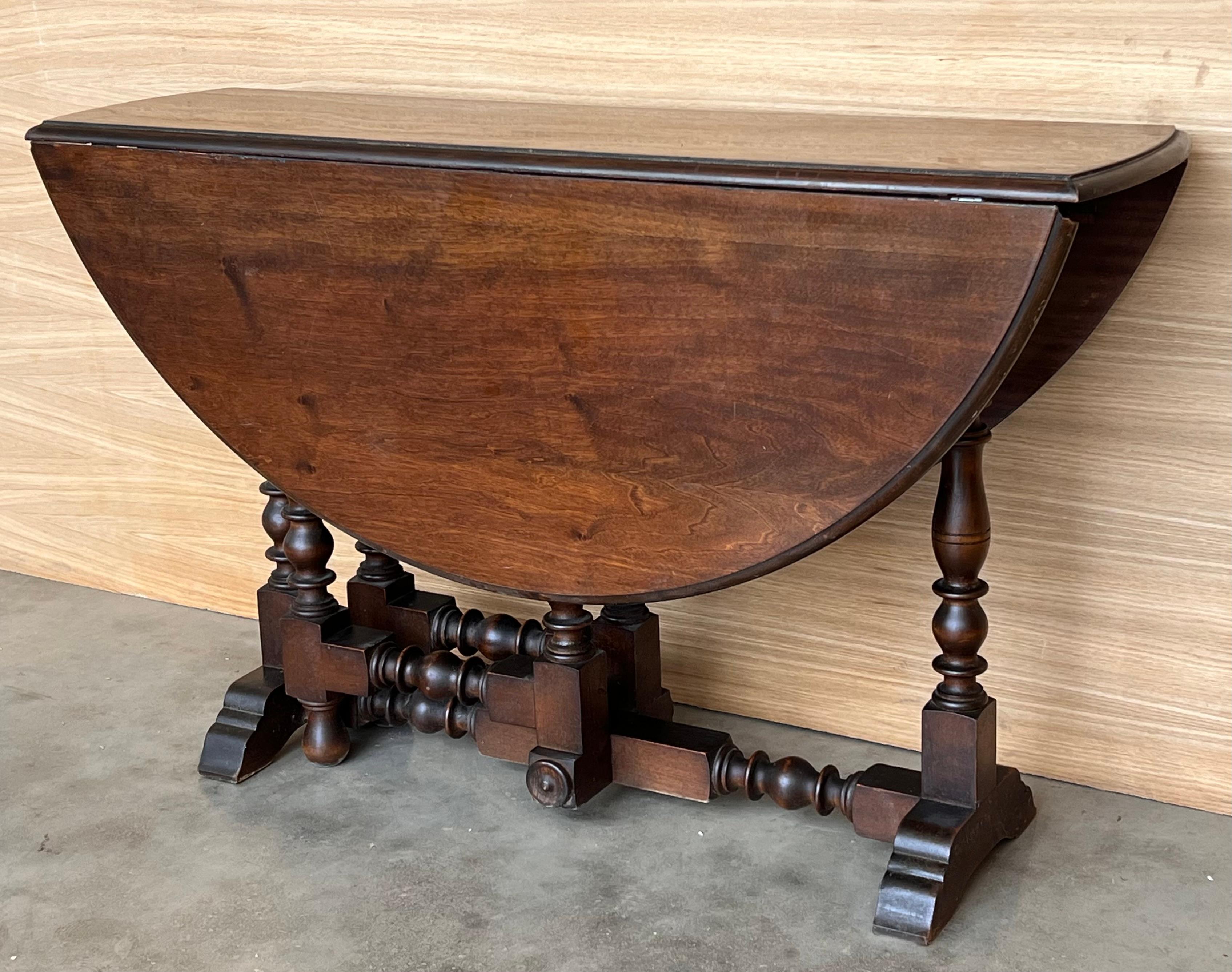 Spanish Round Folding Dining Table with Beveled Top and Carved Legs, 1940s For Sale
