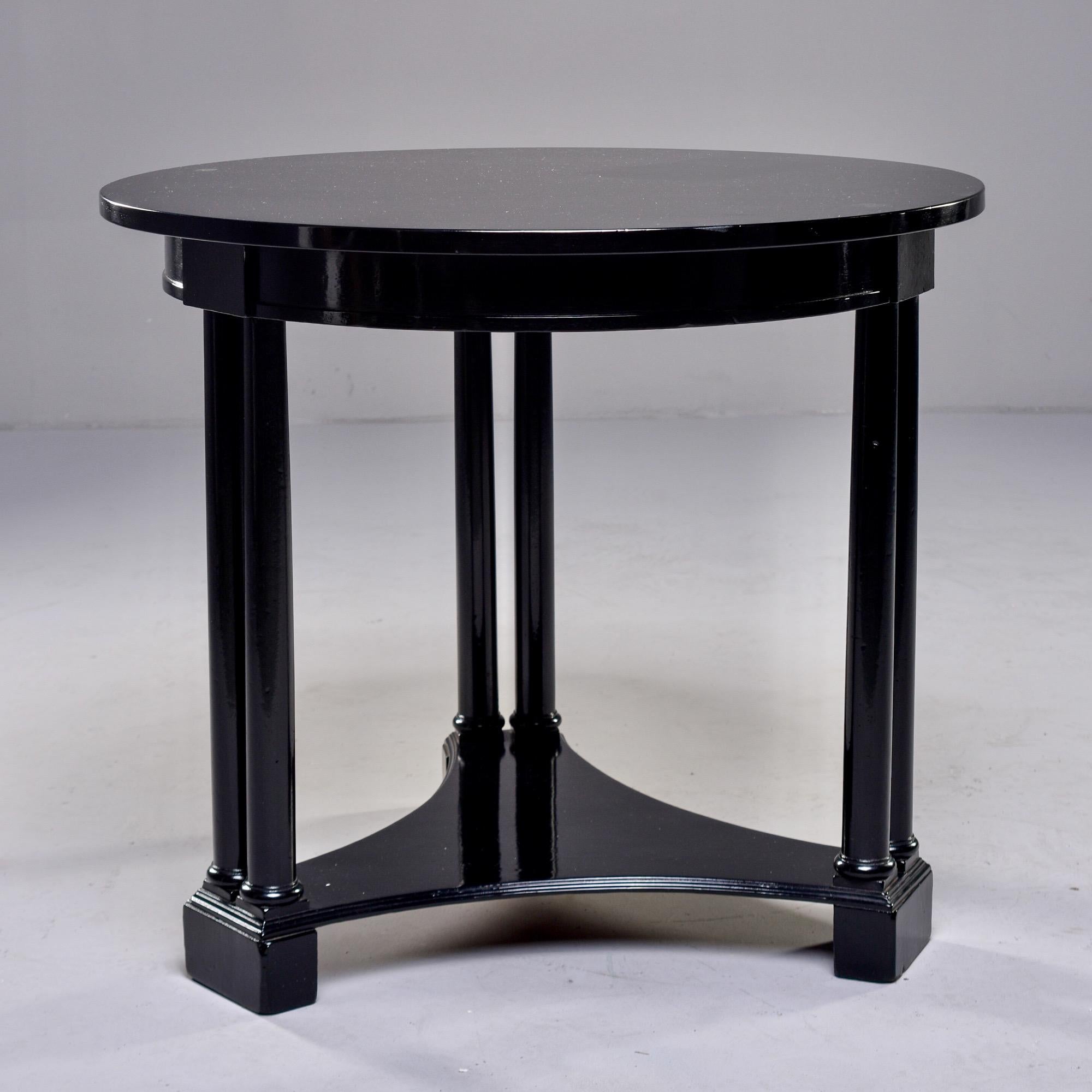 Circa 1930s French Art Deco side table has round top and three leg pedestal base with a new ebonised finish. Unknown maker.