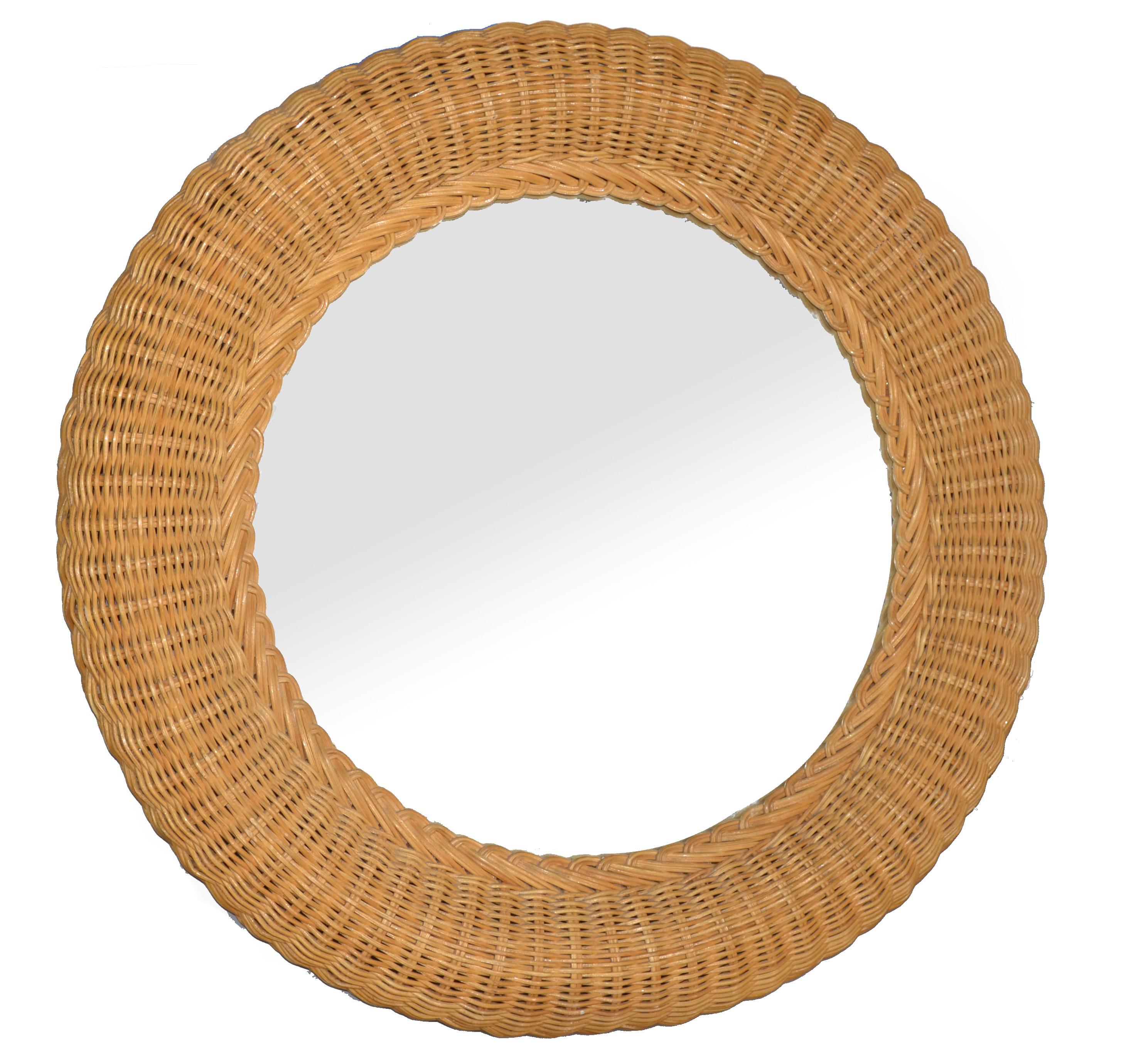 French Coastal Mid-Century Modern Bohemian chic round shaped handwoven pencil reed and wicker wall mirror.
Exemplary construction bent pencil reed are firmly lined on a sturdy wooden backing.
Tropical Coastal Design for Your Sunroom.
Mirror Glass