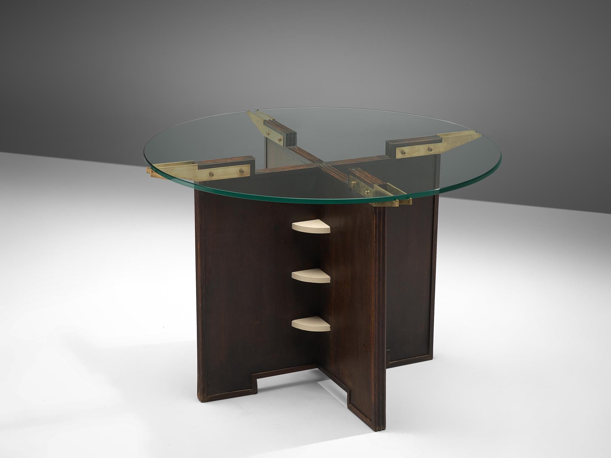 Side table, lacquered wood, glass and brass, France, 1950s.

This gueridon table features a robust, late Art Deco style base. The frame is made of darkened wood, with white lacquered details in the middle. The top is finished with brass supports.