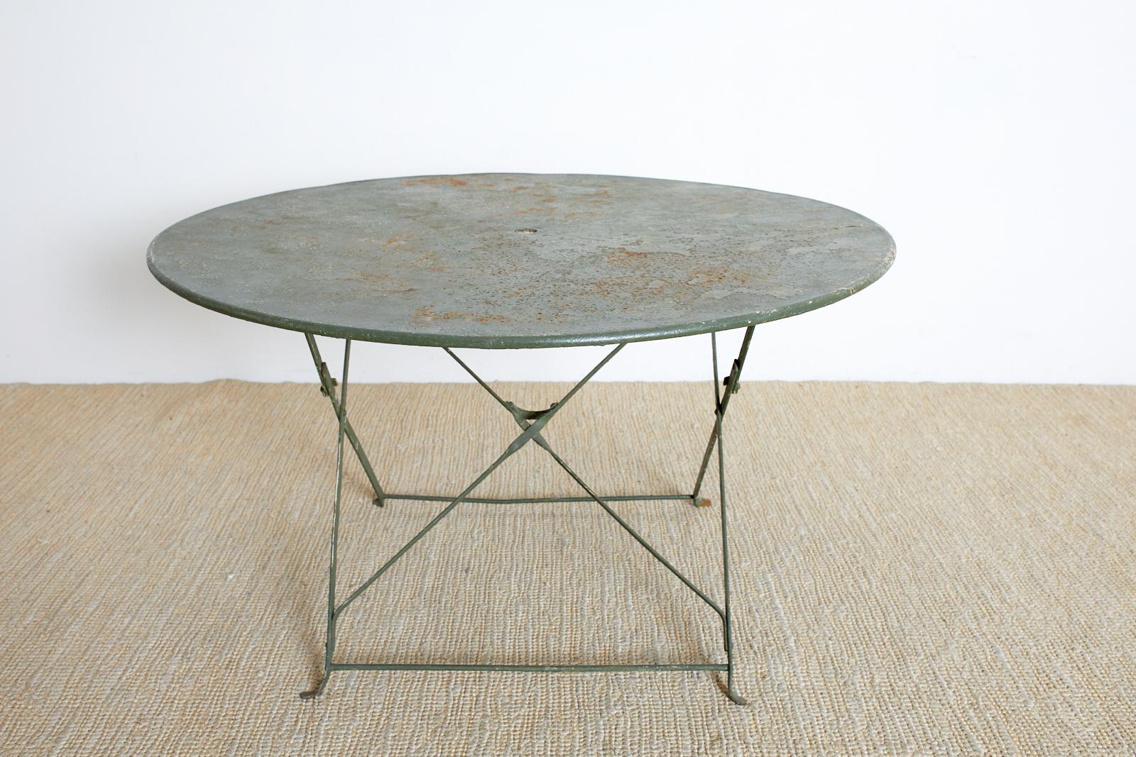 Round French Iron Folding Garden Dining Table In Distressed Condition In Rio Vista, CA