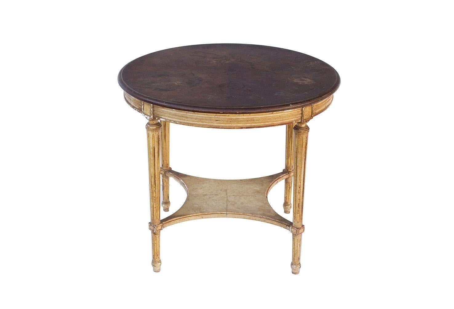 USA, 1940s
Round French style side table by John Widdicomb. Fluted legs and what appears to be a starburst walnut top. Retains metal label on underside.

CONDITION NOTES: Shows heavy, chippy wear.

DIMENSIONS: 26