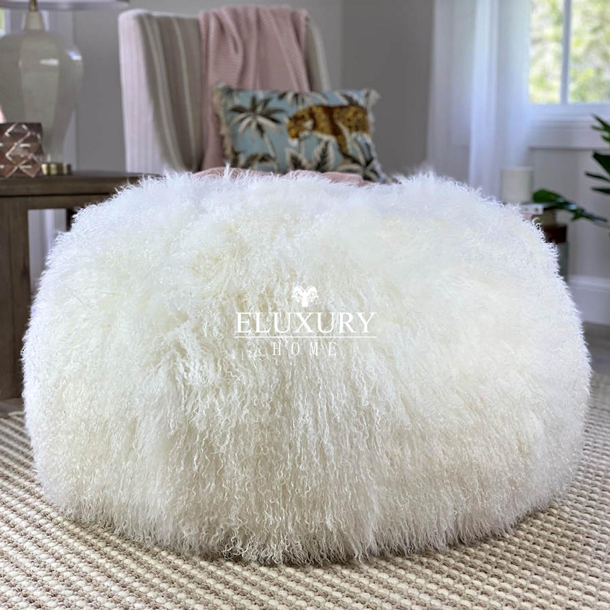 This round fur ottoman will be the wow factor that your decor needs. The snow white Mongolian fur ottoman will look and feel super lush in any interior setting. It features the most luxurious and silky fur wool that will grace a room with