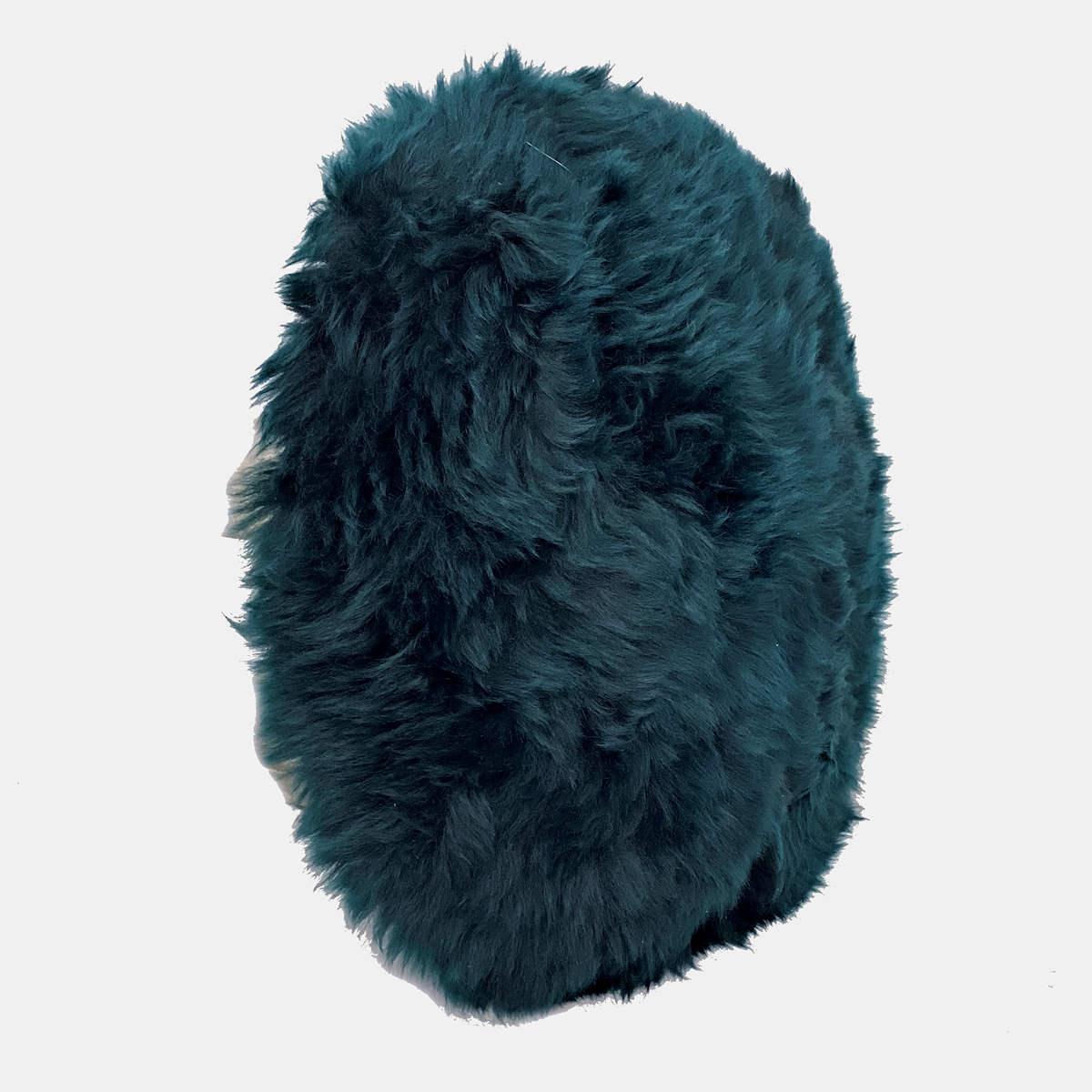 Introduce rich and irresistible textures into an interior with this sumptuous round fur pillow. Featuring a thick and pure wool pile with superior silky softness, this collection of fur pillows is hand-crafted from beautiful high-quality New Zealand