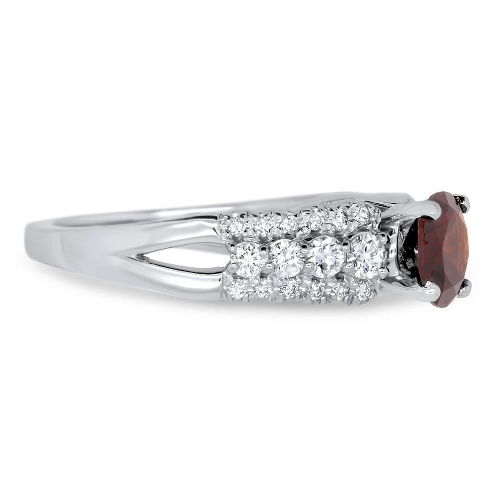 Material: 14k White Gold 
Center Stone Details: 1.33  Carat Round Garnet
Mounting Diamond Details: 32 Round White Diamonds Approximately 0.52 Carats - Clarity: SI / Color: H-I
Ring Size: Size 6.5. Alberto offers complimentary sizing on all