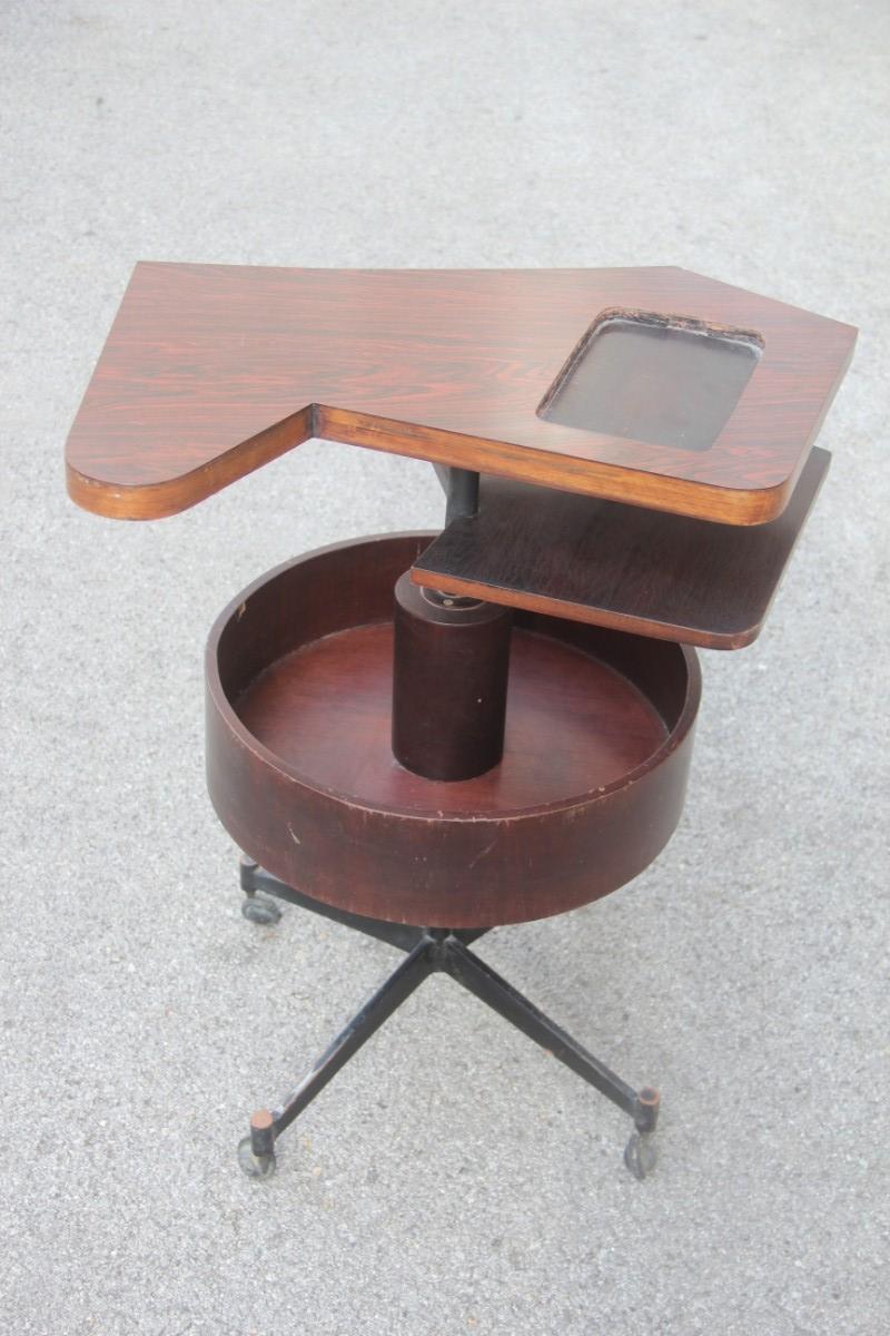Old round geometric bar table revolving iron rosewood laminate, 1950s.