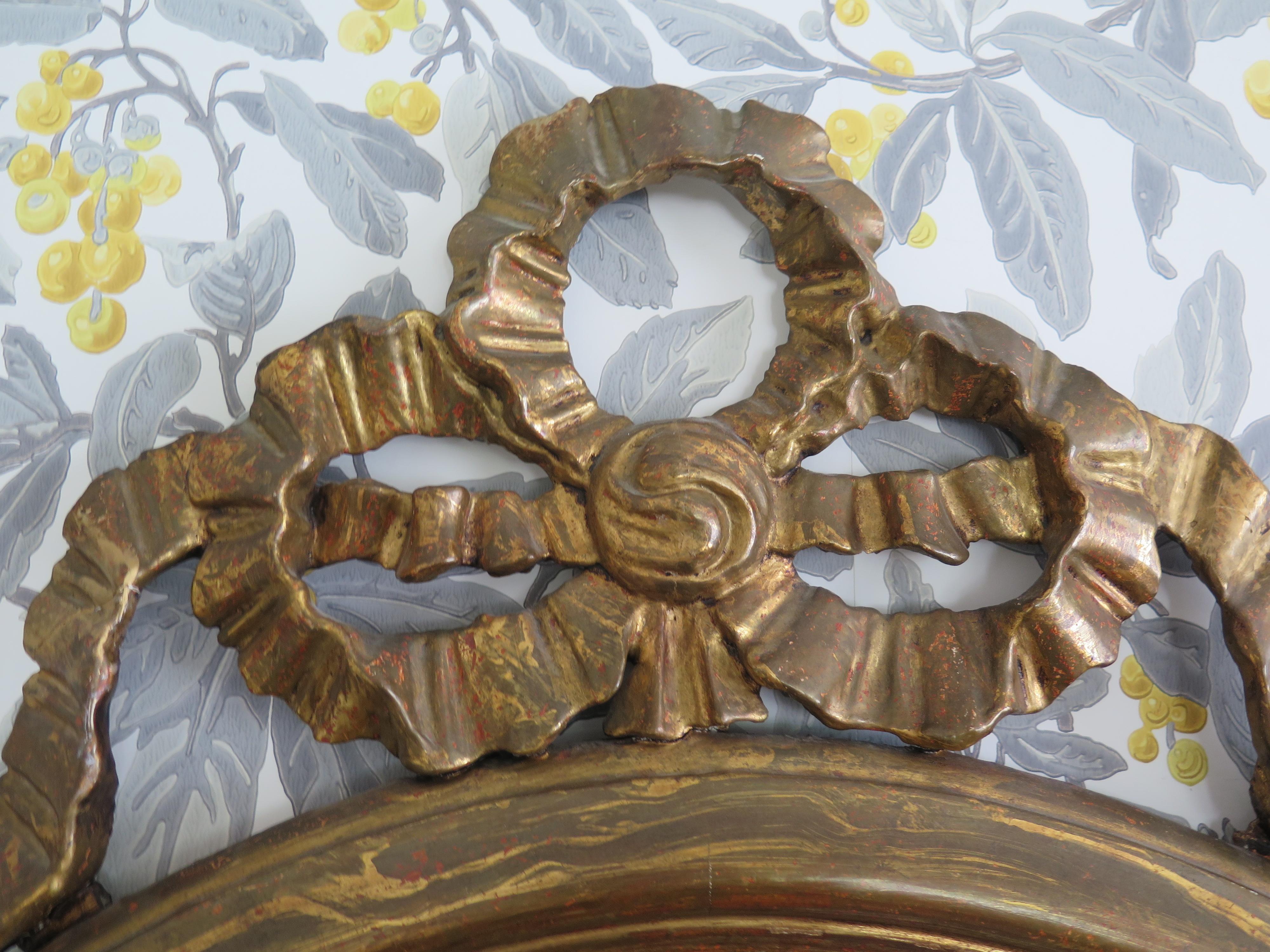 Round Gilded Mirror Adorned with Bow 1