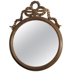 Round Gilded Mirror Adorned with Bow