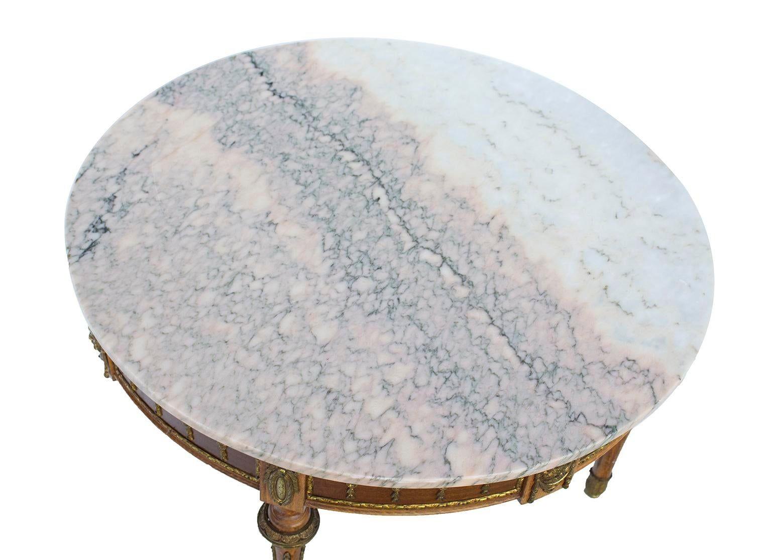 Likely Italy, 1940s
Beautiful smaller round cocktail table with a gorgeous pink marble top and an Vintage base. Brass detailing around the edges of the table and on each of the four legs. Mix with any style.
CONDITION NOTES: Light marks to