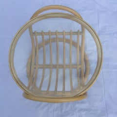 Round glass and rattan coffee table
