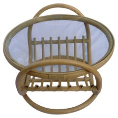 Round glass and rattan coffee table