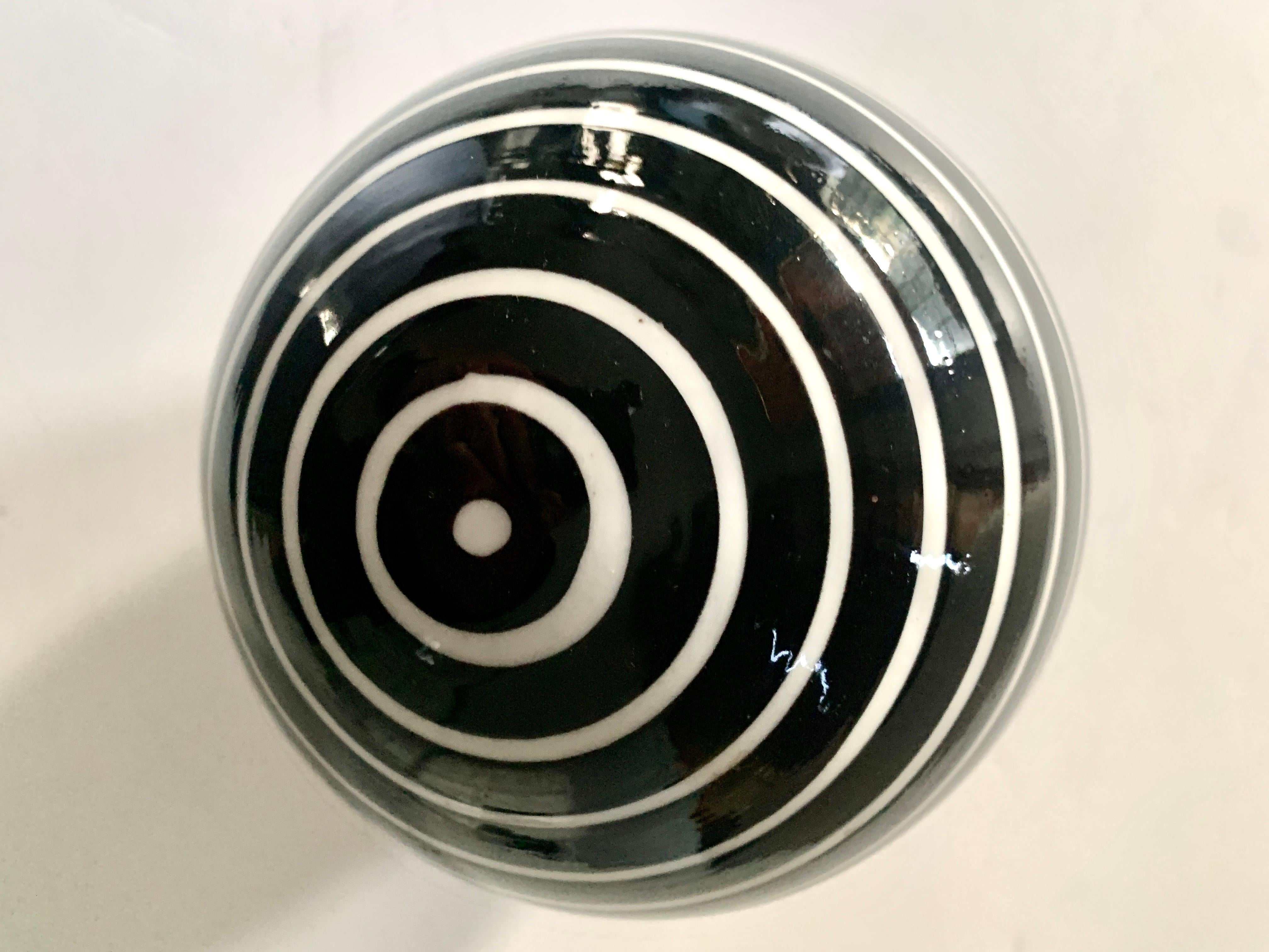 Round Glass Sphere Paper Weight with White Stripes on a Black Field 6