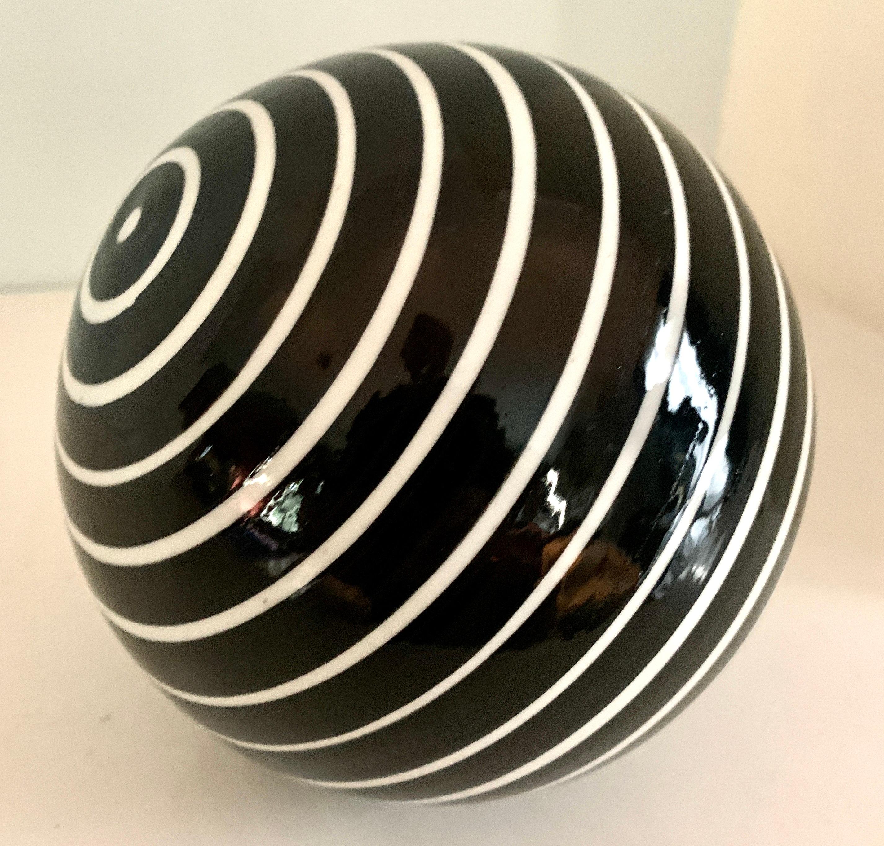 Round Glass Sphere Paper Weight with White Stripes on a Black Field 1
