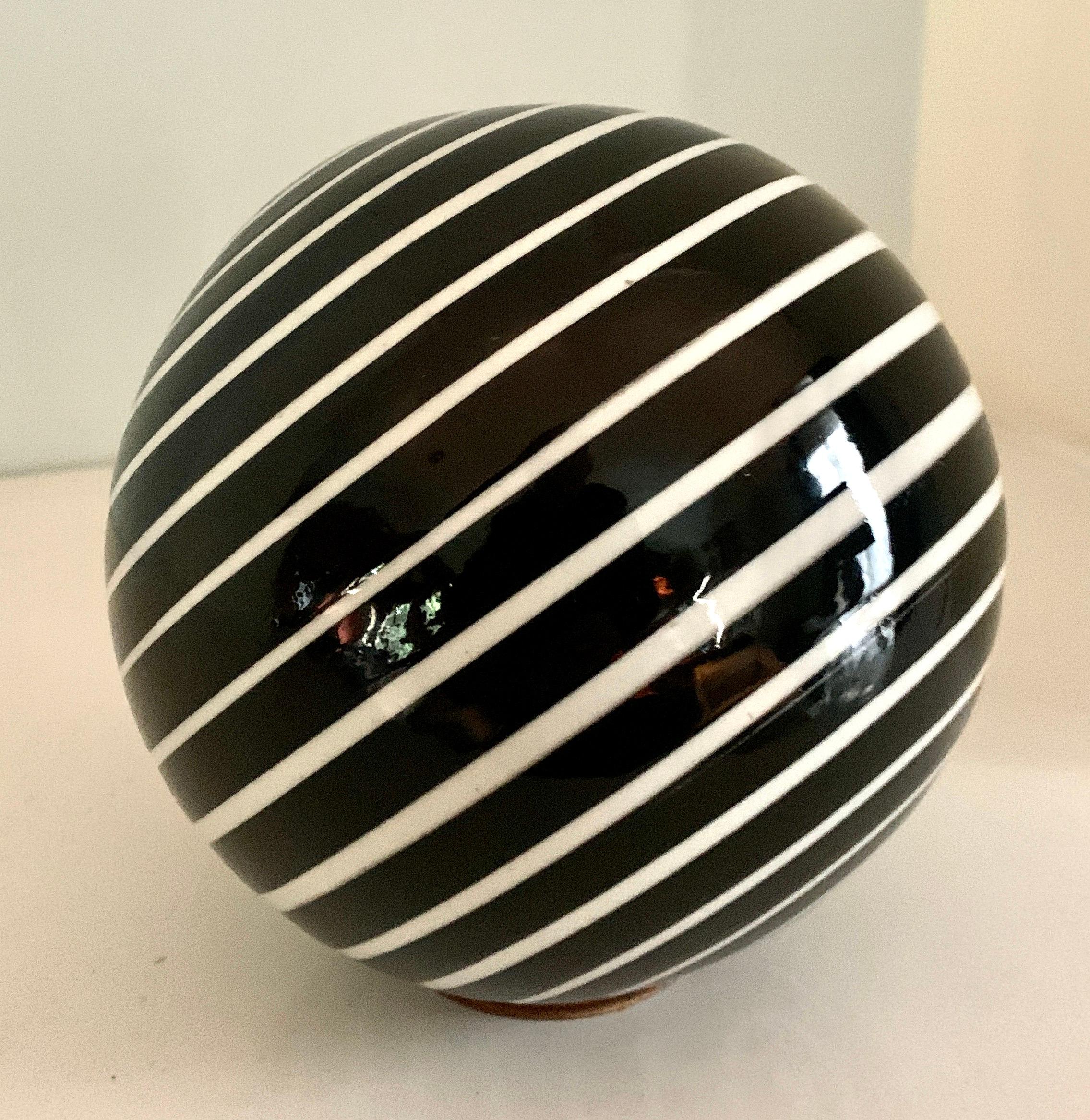 Round Glass Sphere Paper Weight with White Stripes on a Black Field 2