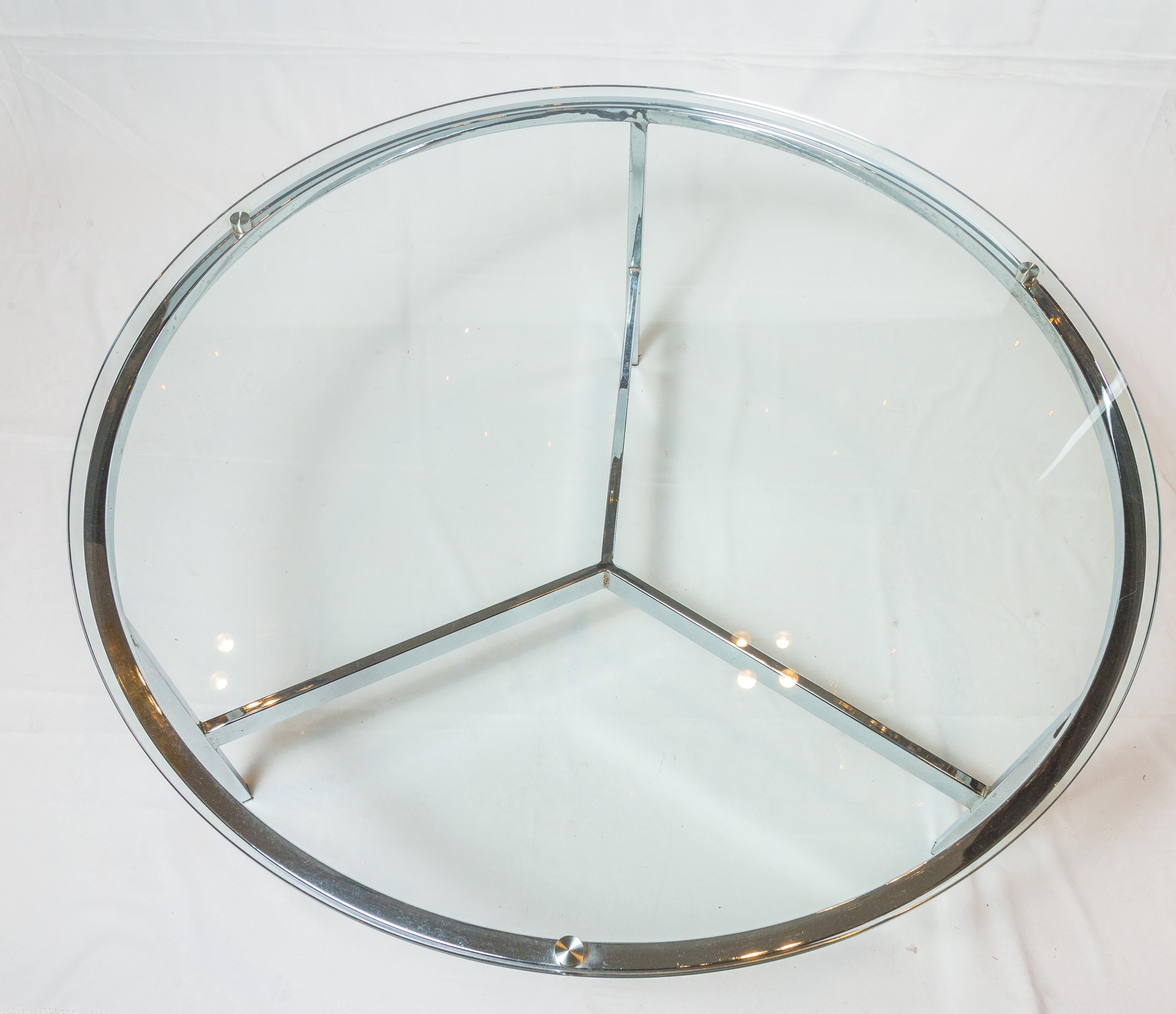 Round silver glass center table, perfect for the livingroom area.
