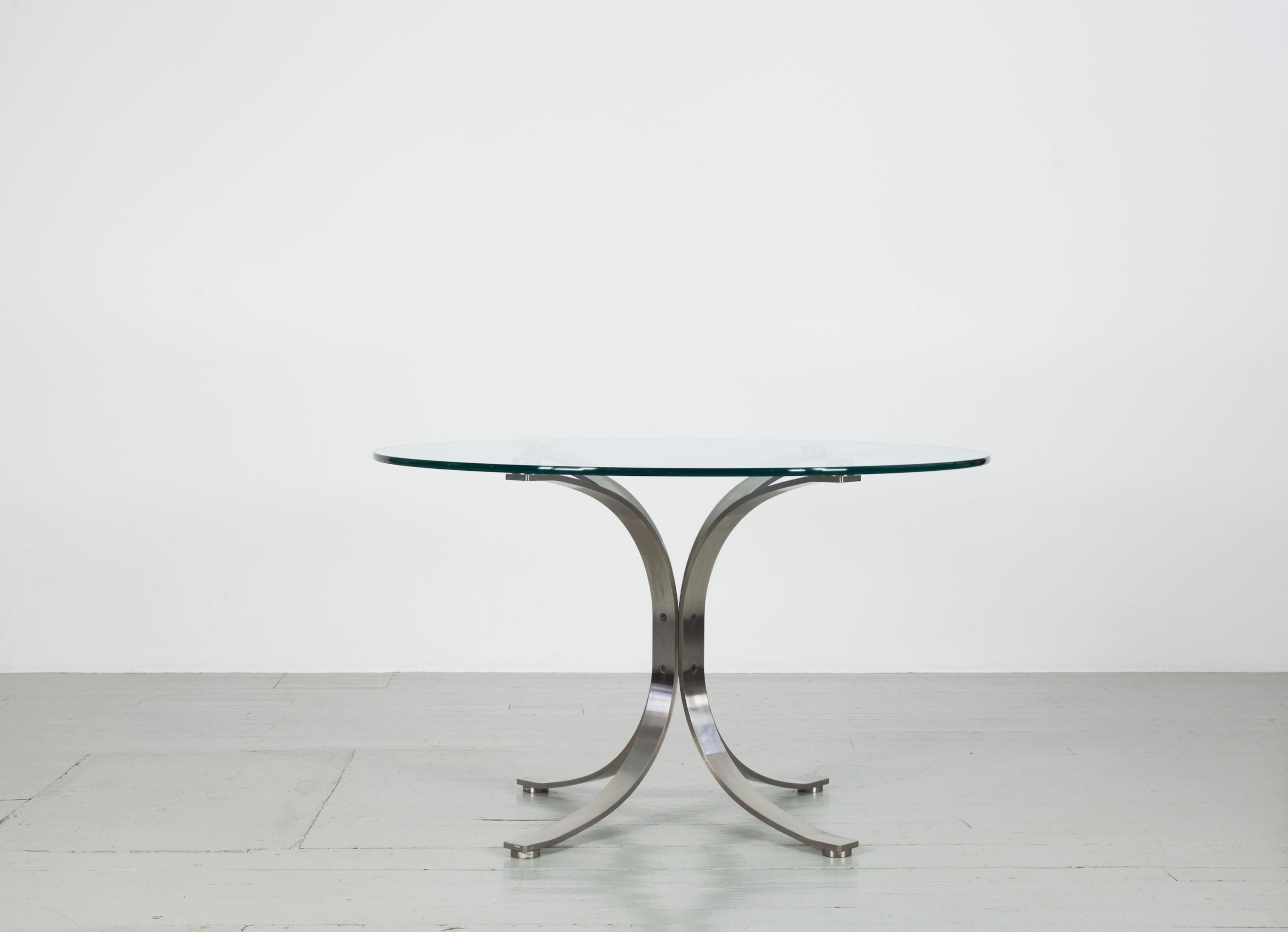 Round glass table in the style of Eugenio Gerli & Osvaldo Borsani.
Brushed chrome steel with crystal glass top, Italy, 1970s.