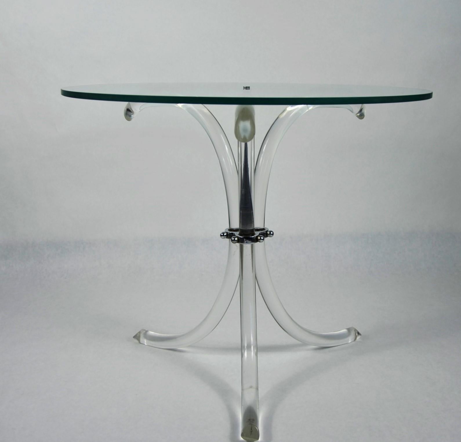 Offered is a Mid-Century Modern Charles Hollis Jones style round glass top, chrome accents and Lucite tripod legs side / end and / or occasional table. Wonderfully sleek and sophisticated design that would blend well with any type of decor. This