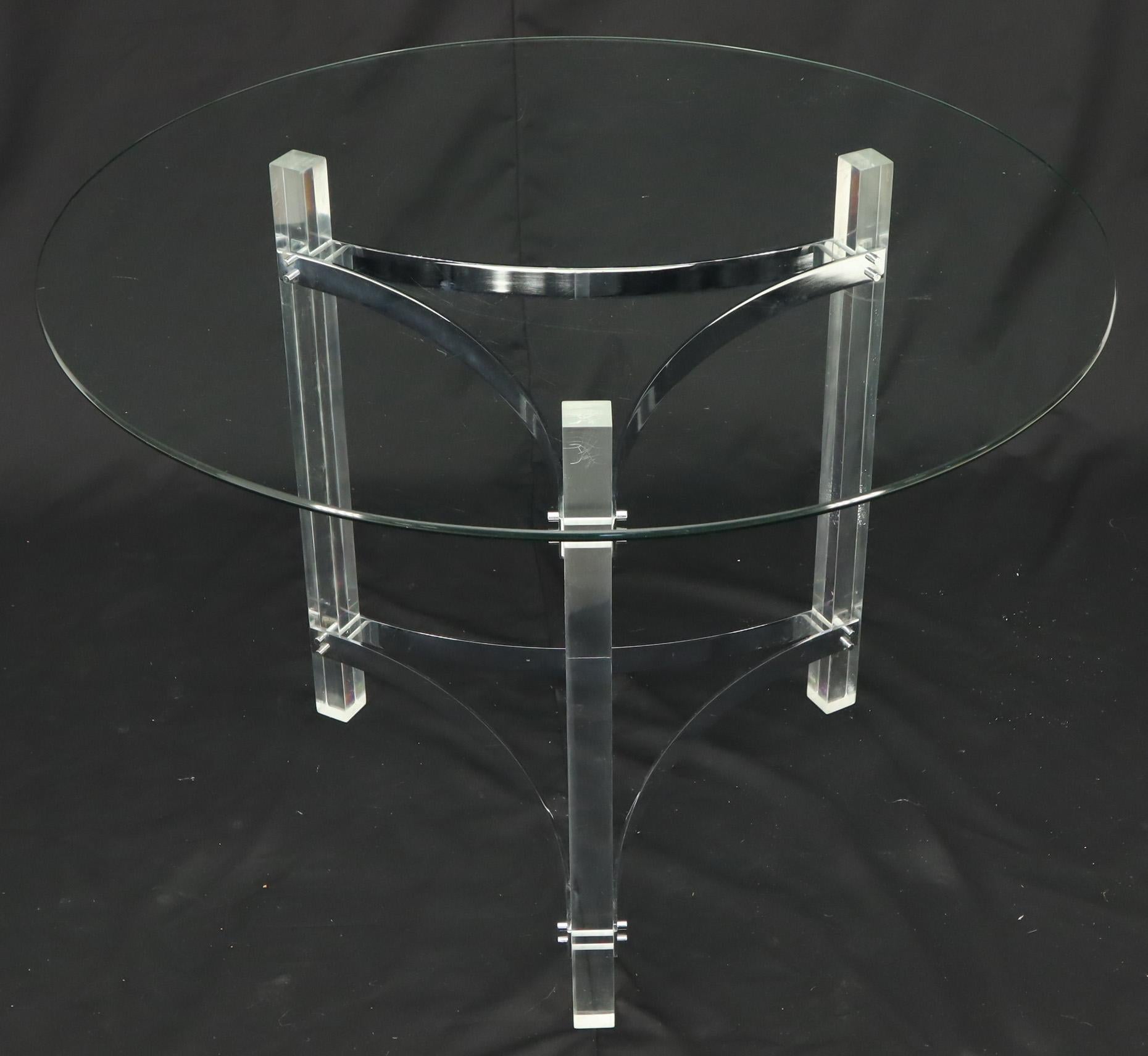 Mid-Century Modern small round dining center table. Chrome and Lucite tripod base. In the style of Pace.
