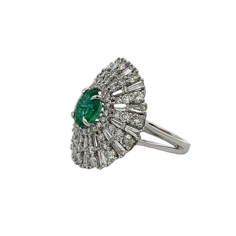 Introducing our exquisite green, emerald ring that is sure to capture your heart. The stunning green gemstone shimmers with every movement, making it a true centerpiece. This magnificent ring boasts a remarkable 1.78-carat green round emerald