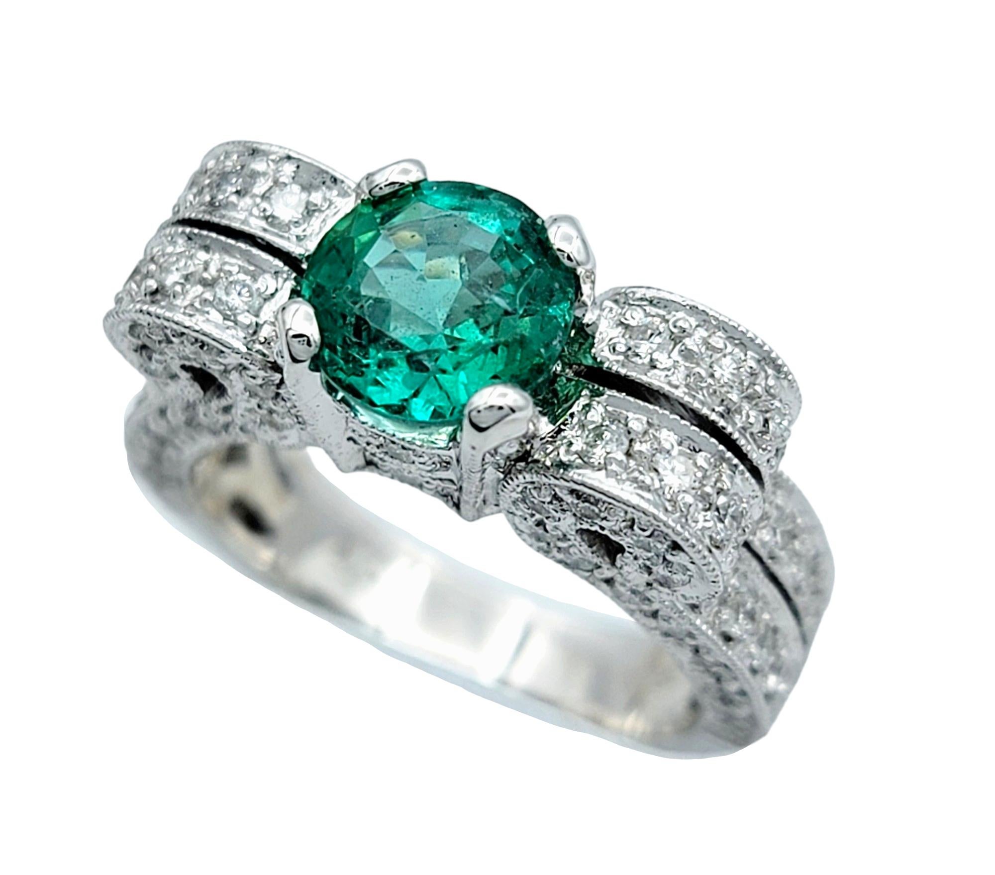 Ring size: 5

Indulge in utter luxury with this exquisite emerald and diamond ring, set in opulent 18k white gold. The emerald takes center stage, held securely in a classic 4-prong setting, allowing its vibrant green hue to shine with unparalleled