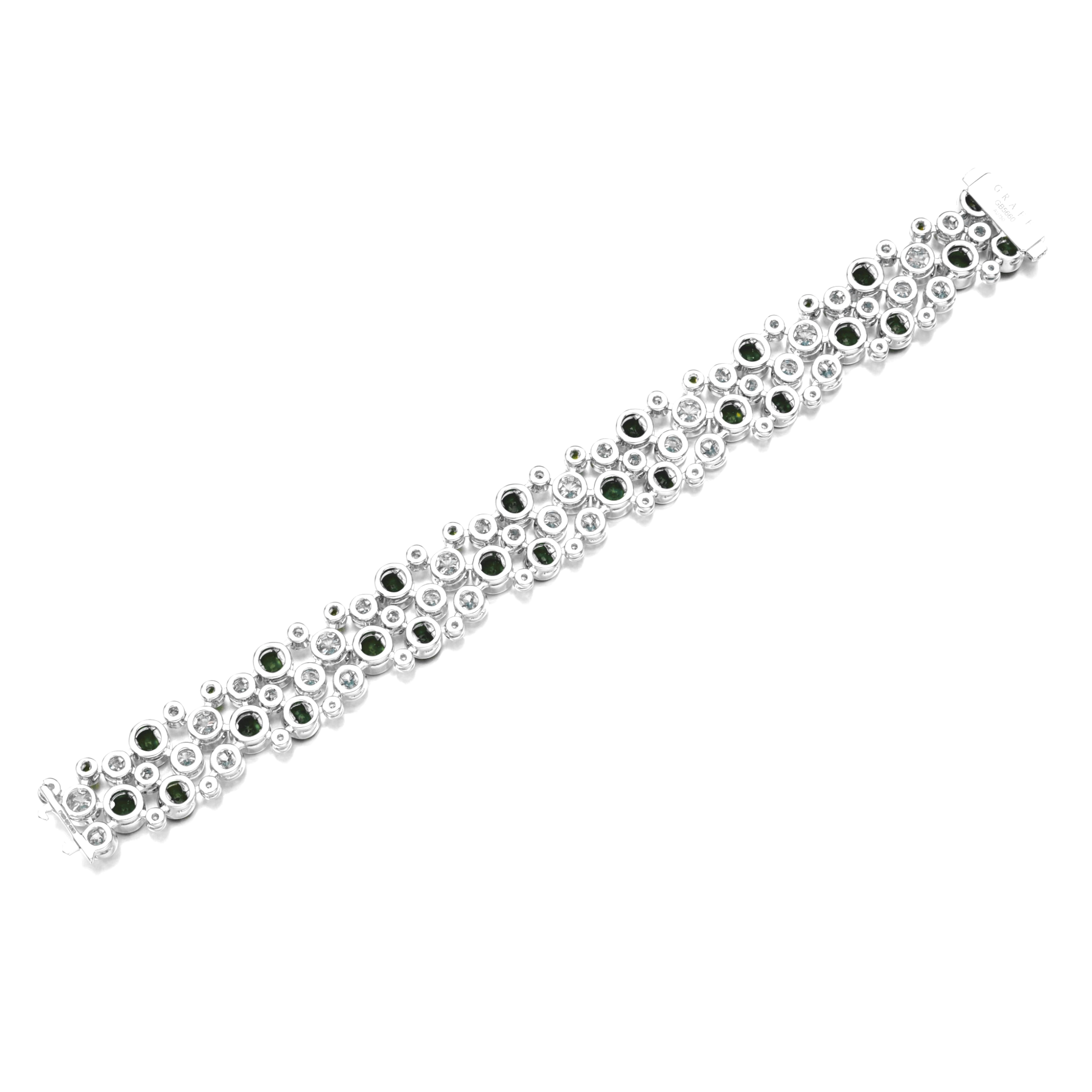 breathtaking bracelet crafted in 14k white gold, designed as an articulated series of collet-set brilliant-cut diamonds and circular-cut emeralds. Measuring approximately 180 mm in length, this exquisite piece showcases a harmonious blend of luxury