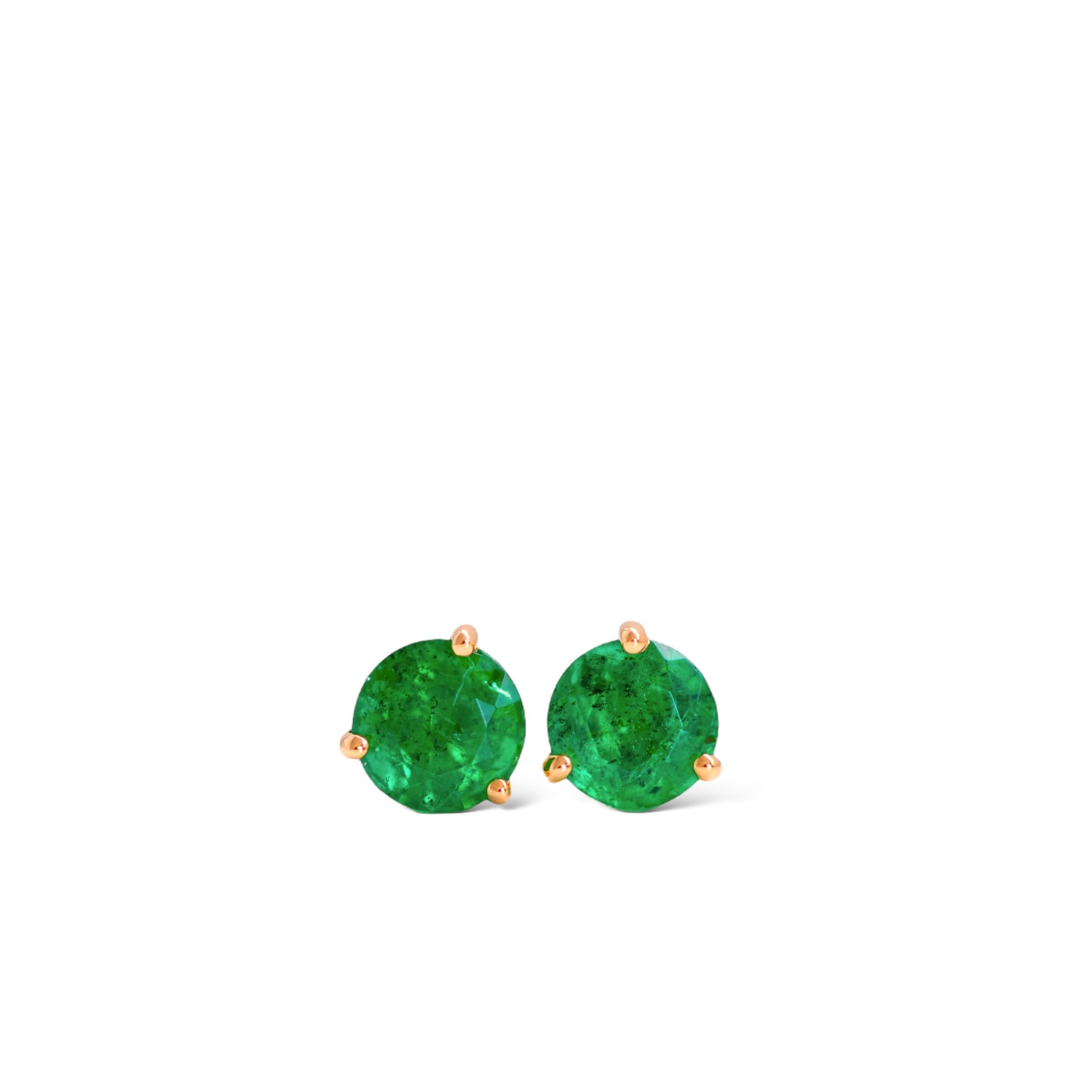 Stunning 0.74ct natural round green emerald studs set in luxurious 18k yellow gold.

These beautiful perfectly matched emeralds are from Zambia and measure 4.5mm each. The emerald colour is a medium-dark vivid green. The studs are set in a