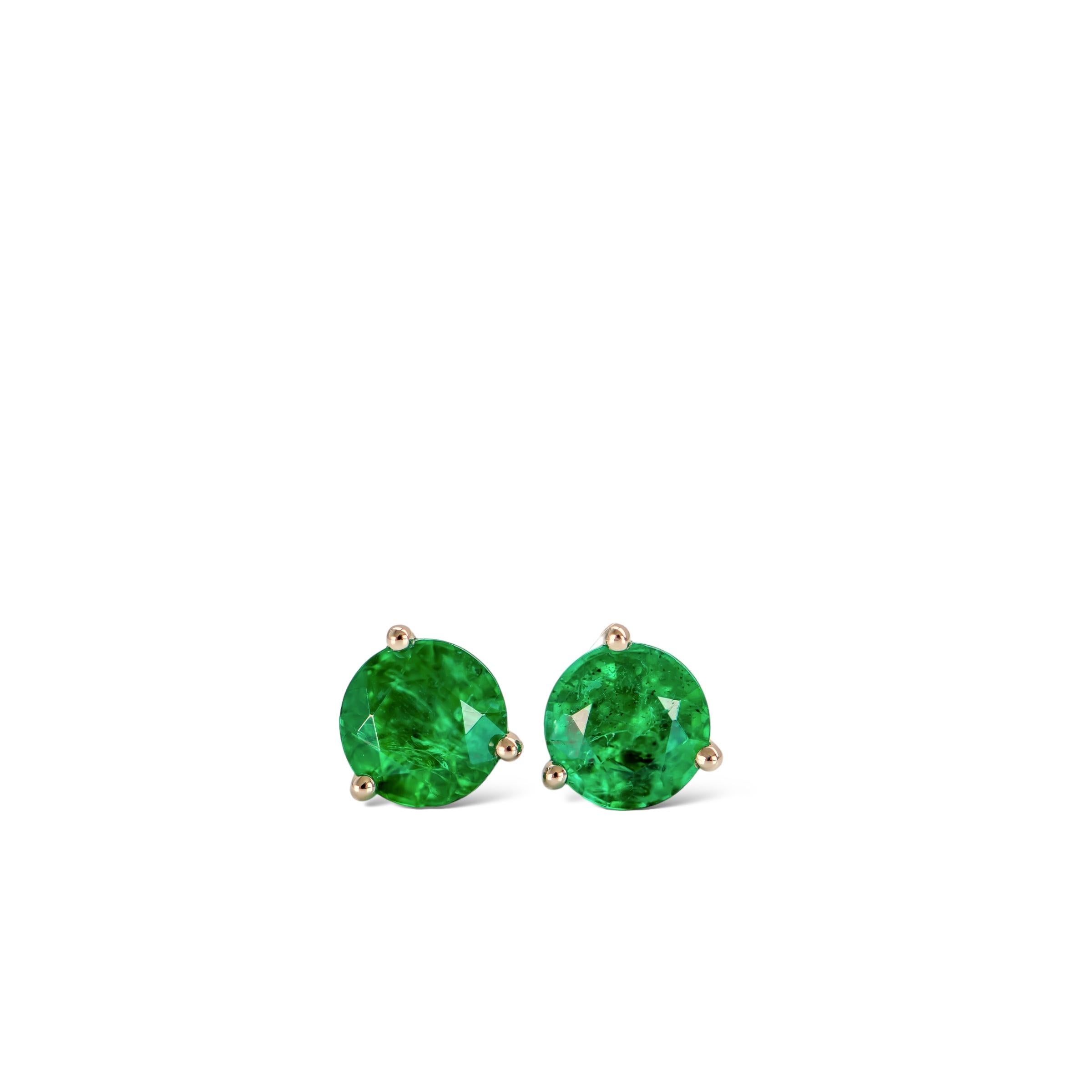 Stunning 0.67ct natural round green emerald studs set in luxurious platinum.

These beautiful perfectly matched emeralds are from Zambia and measure 4.5mm each. 

The emerald colour is a medium-dark vivid green. The studs are set in a three-prong