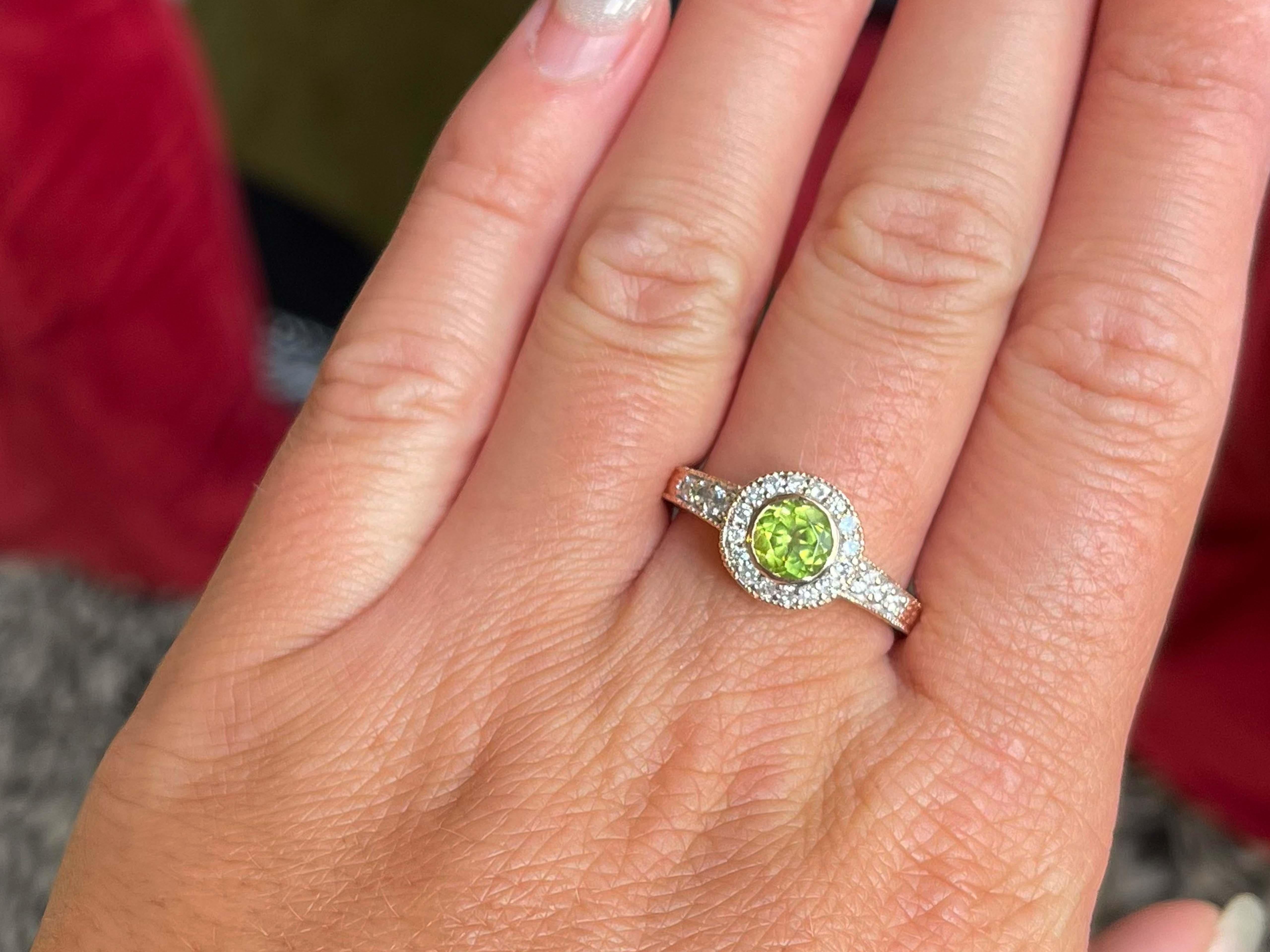 Item Specifications:

Metal: 14K Pink Gold

Ring Size: 9

Style: Statement Ring

Total Weight: 5.1 Grams

Gemstone Specifications:

Gemstones: 1 green peridot

Peridot Measurements: 6.7 x 6.9 

Diamond Count: 22

Diamond Color: G-H

Diamond Clarity: