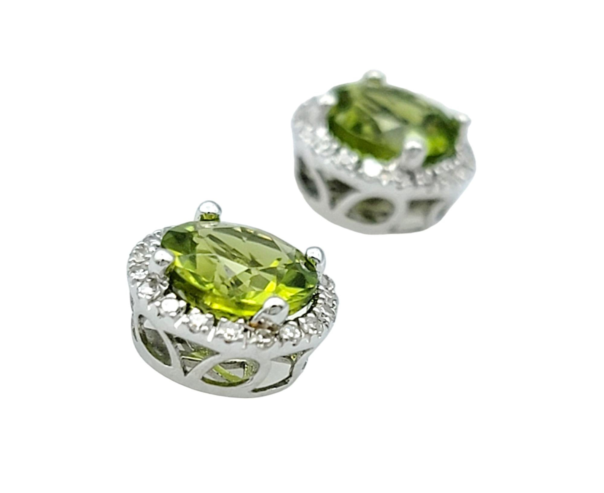 Round Cut Round Green Peridot and Diamond Halo Stud Earrings Set in 14 Karat White Gold For Sale