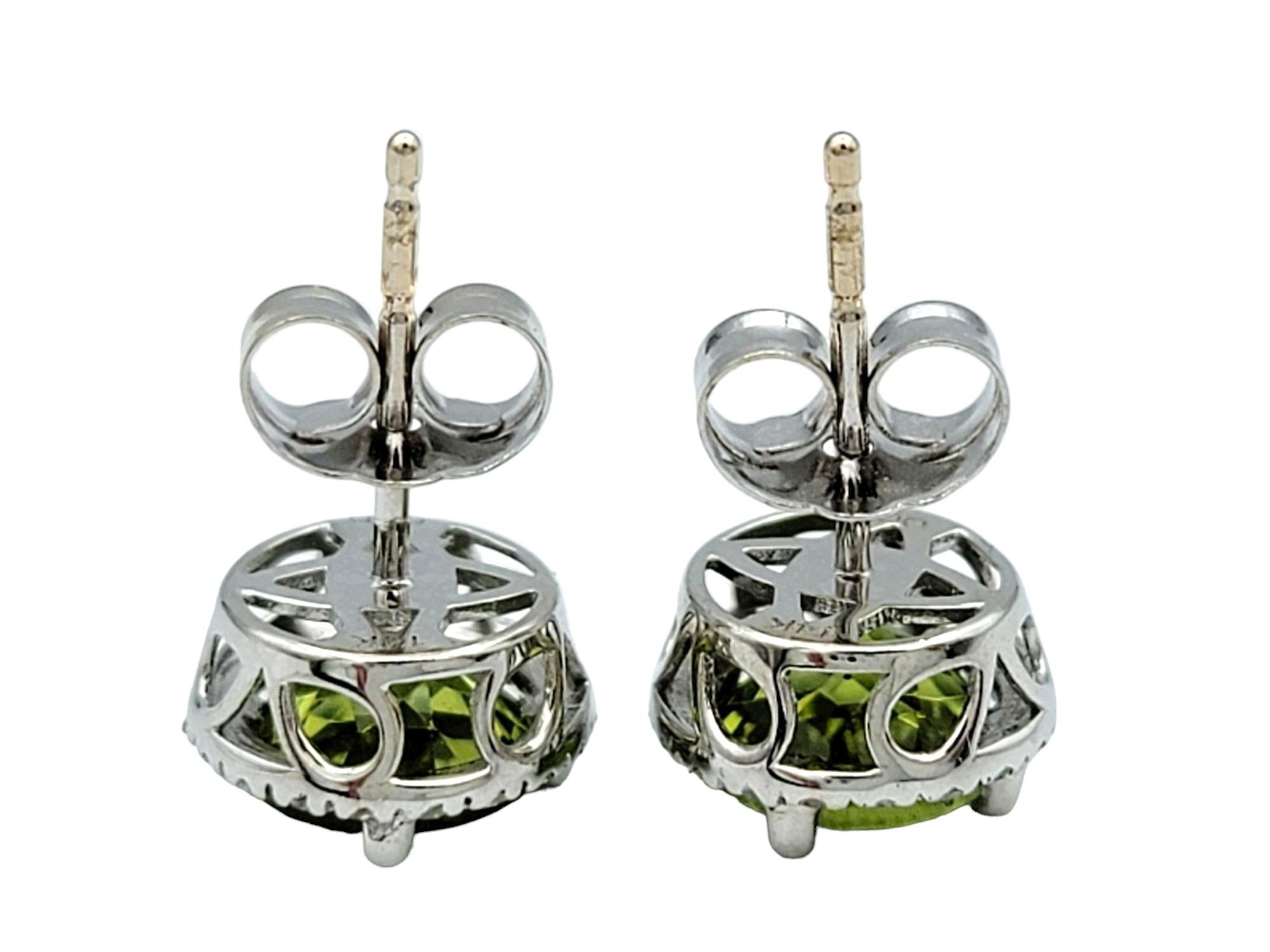 Round Green Peridot and Diamond Halo Stud Earrings Set in 14 Karat White Gold For Sale 1