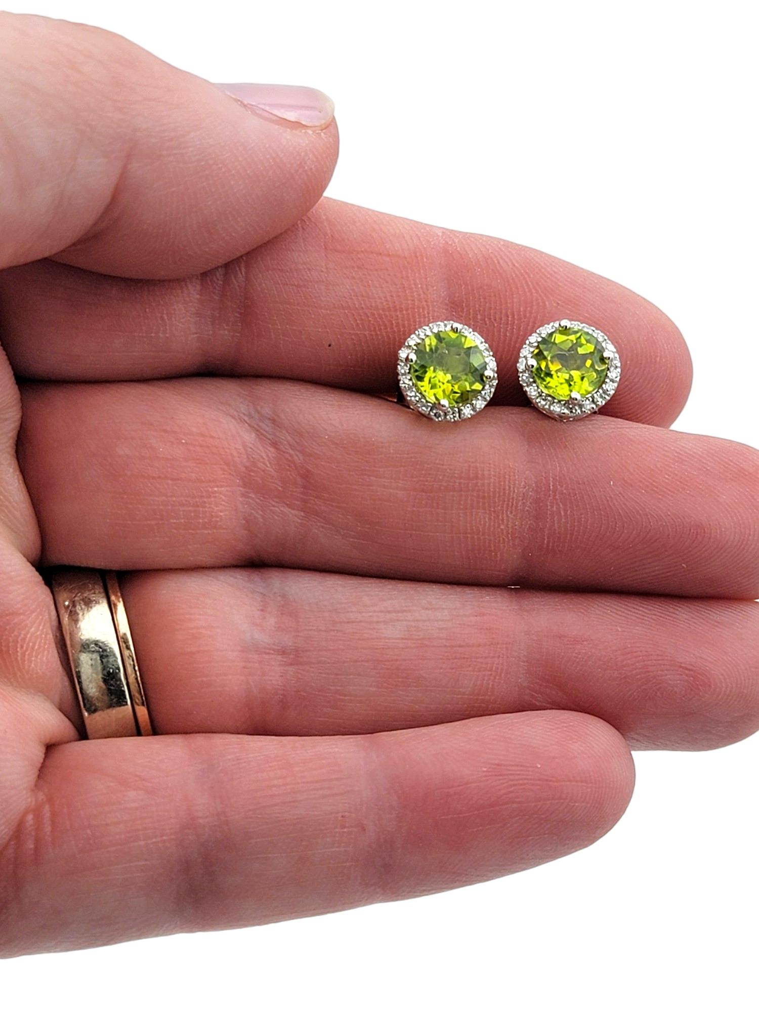 Round Green Peridot and Diamond Halo Stud Earrings Set in 14 Karat White Gold For Sale 3
