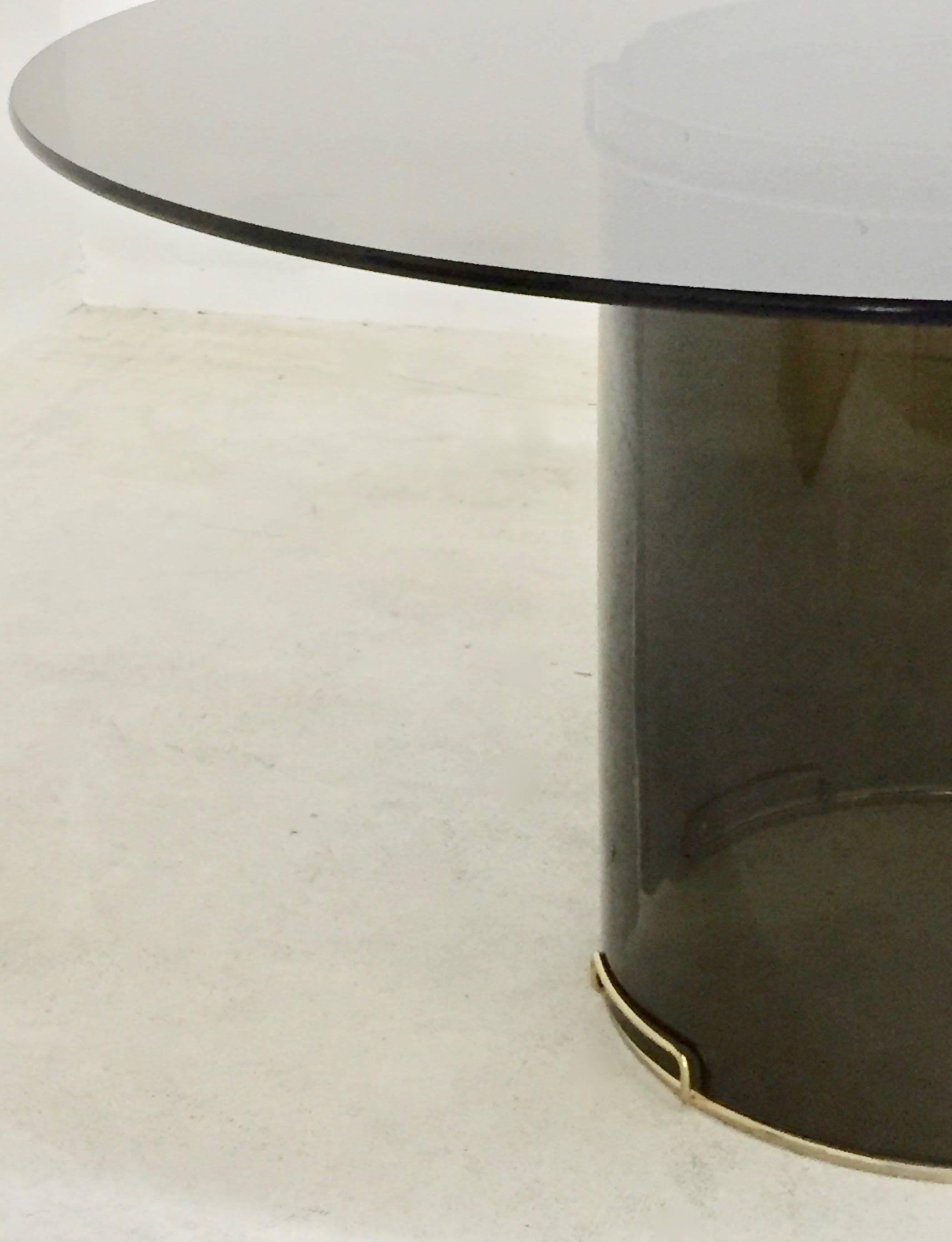 Mid-Century Modern Round Grey Smoky Glass Dining Table with Curved Glass Base and Brass Fittings For Sale