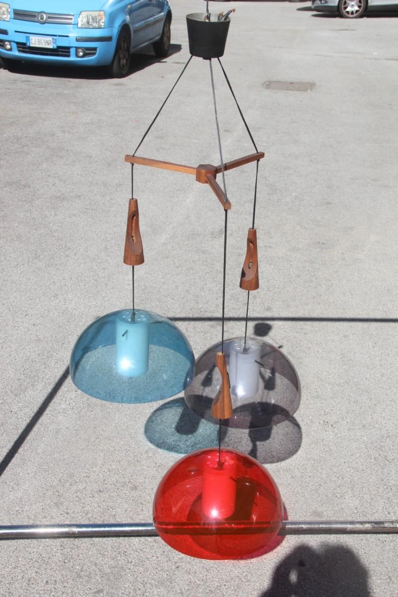 Round Guzzini chandelier red blue wood mahogany Italian design 1960s plexiglass.