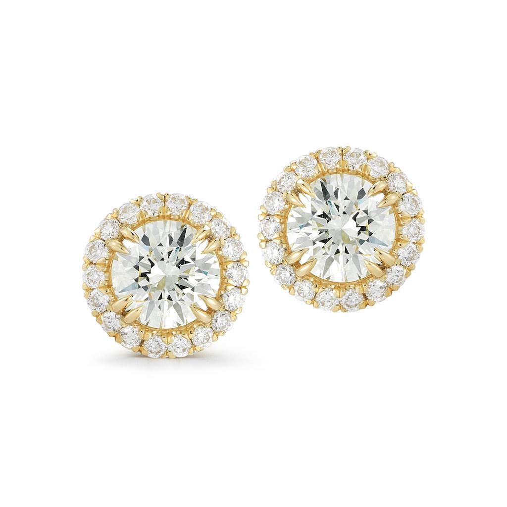 A pair of gorgeous round cut pave set earrings are presented in classic sparkling diamond halos. These stunning and wonderfully wearable, high-quality ear studs rendered in gleaming 18K rose gold. 
Approximately 8mm wide. 
Material: 18K Rose