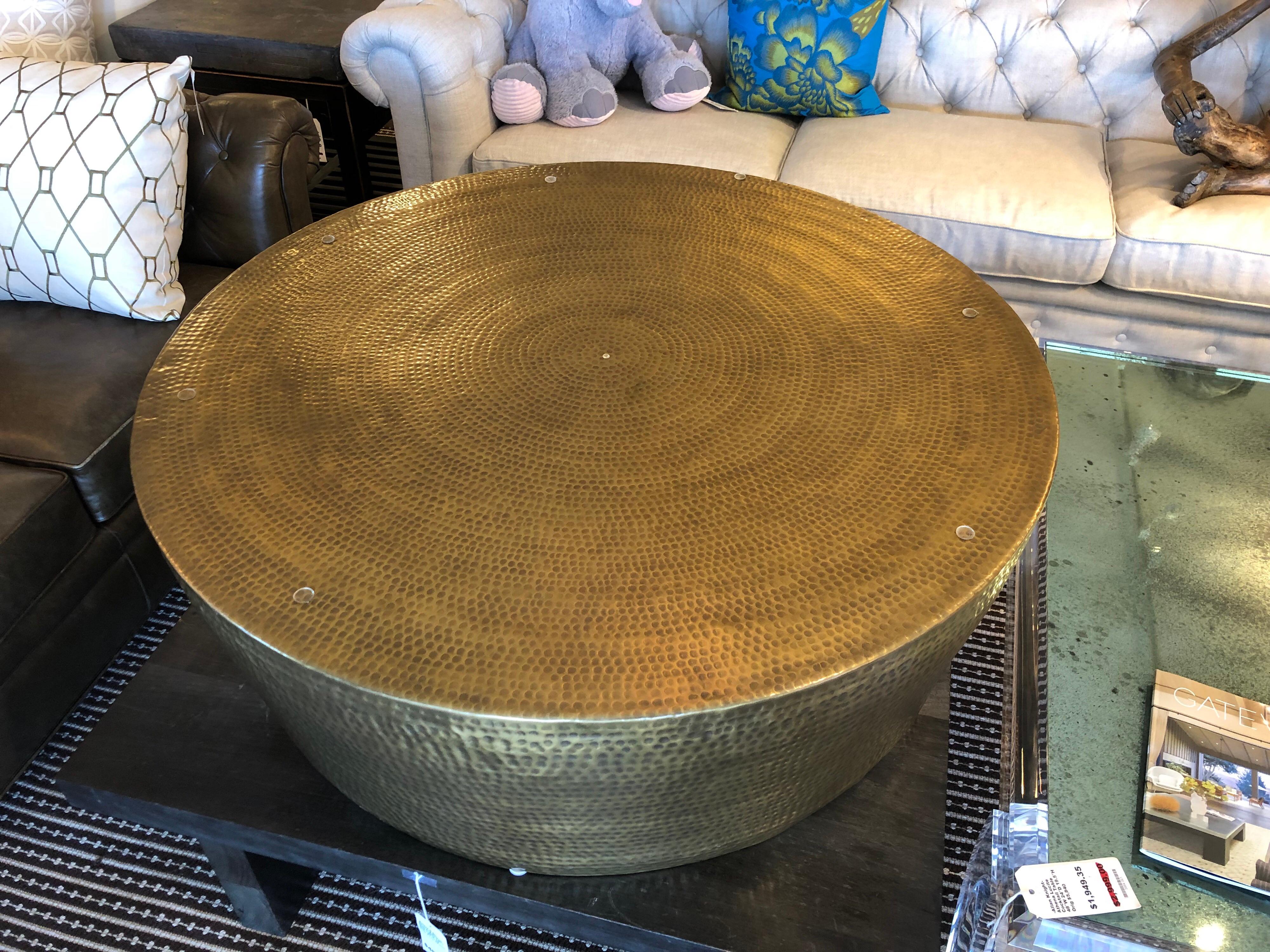 Design Plus Gallery presents beautiful round hammered brass coffee table. Originally purchased from Sunset Home showroom. Table comes with custom round glass for protection. 
Original price $4,497.
