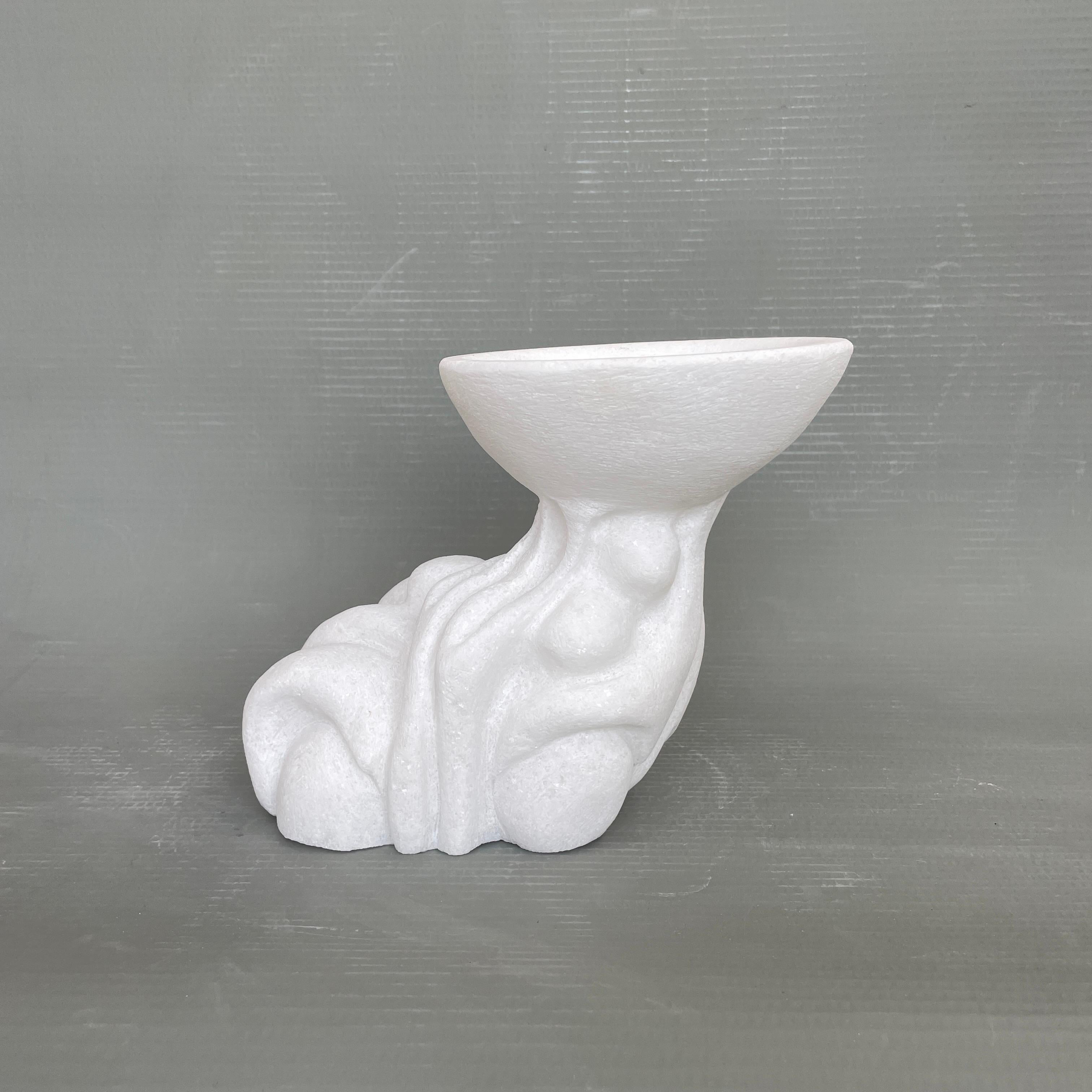 Round hand carved marble vessel by Tom Von Kaenel
Dimensions: D 16 x W 25 x H 21 cm
Materials: Marble

Tom von Kaenel, sculptor and painter, was born in Switzerland in 1961. Already in his early childhood he was deeply devoted to art. His desire