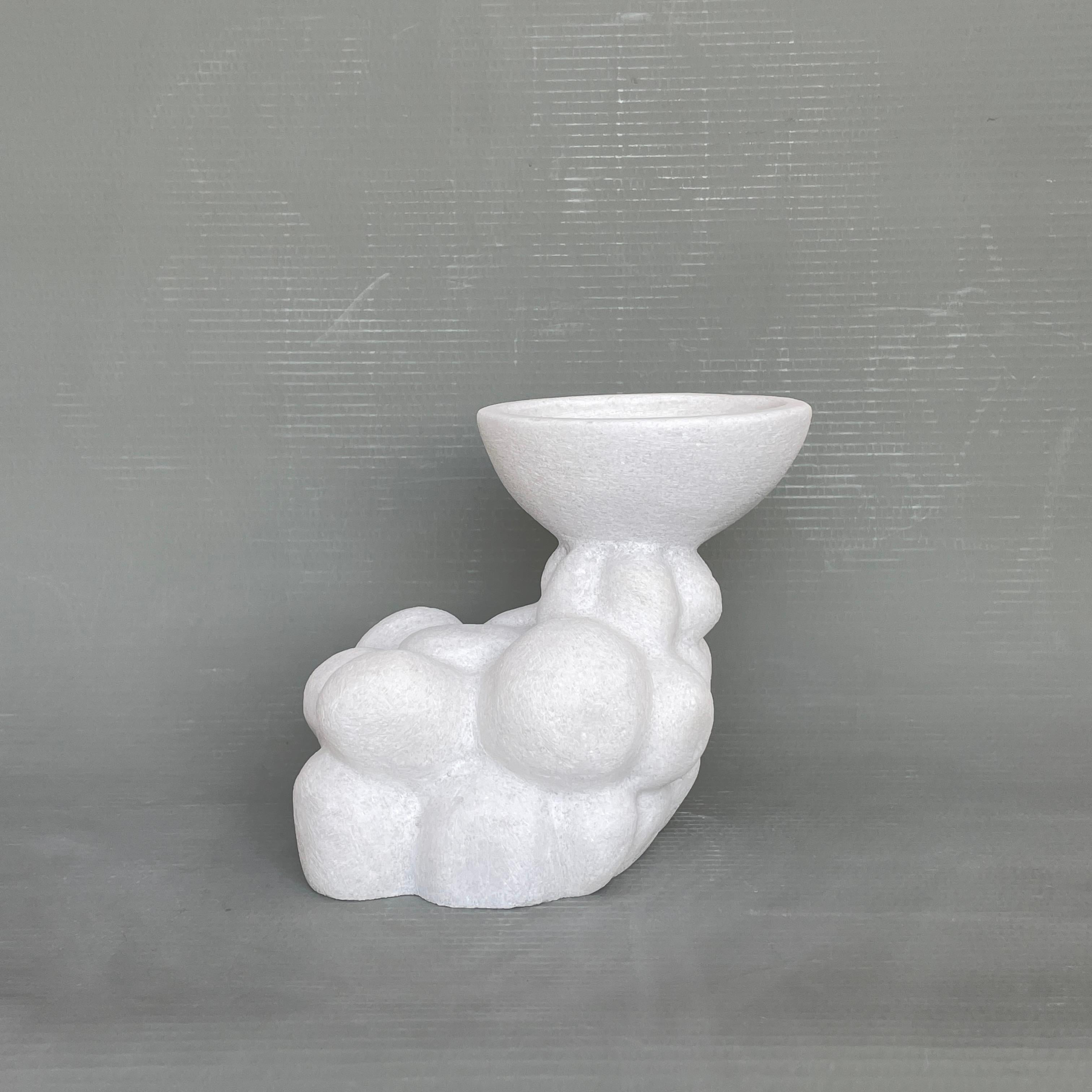 Round hand carved marble vessel by Tom Von Kaenel
Dimensions: D16 x W25 x H21 cm
Materials: Marble

Tom von Kaenel, sculptor and painter, was born in Switzerland in 1961. Already in his early childhood he was deeply devoted to art. His desire to